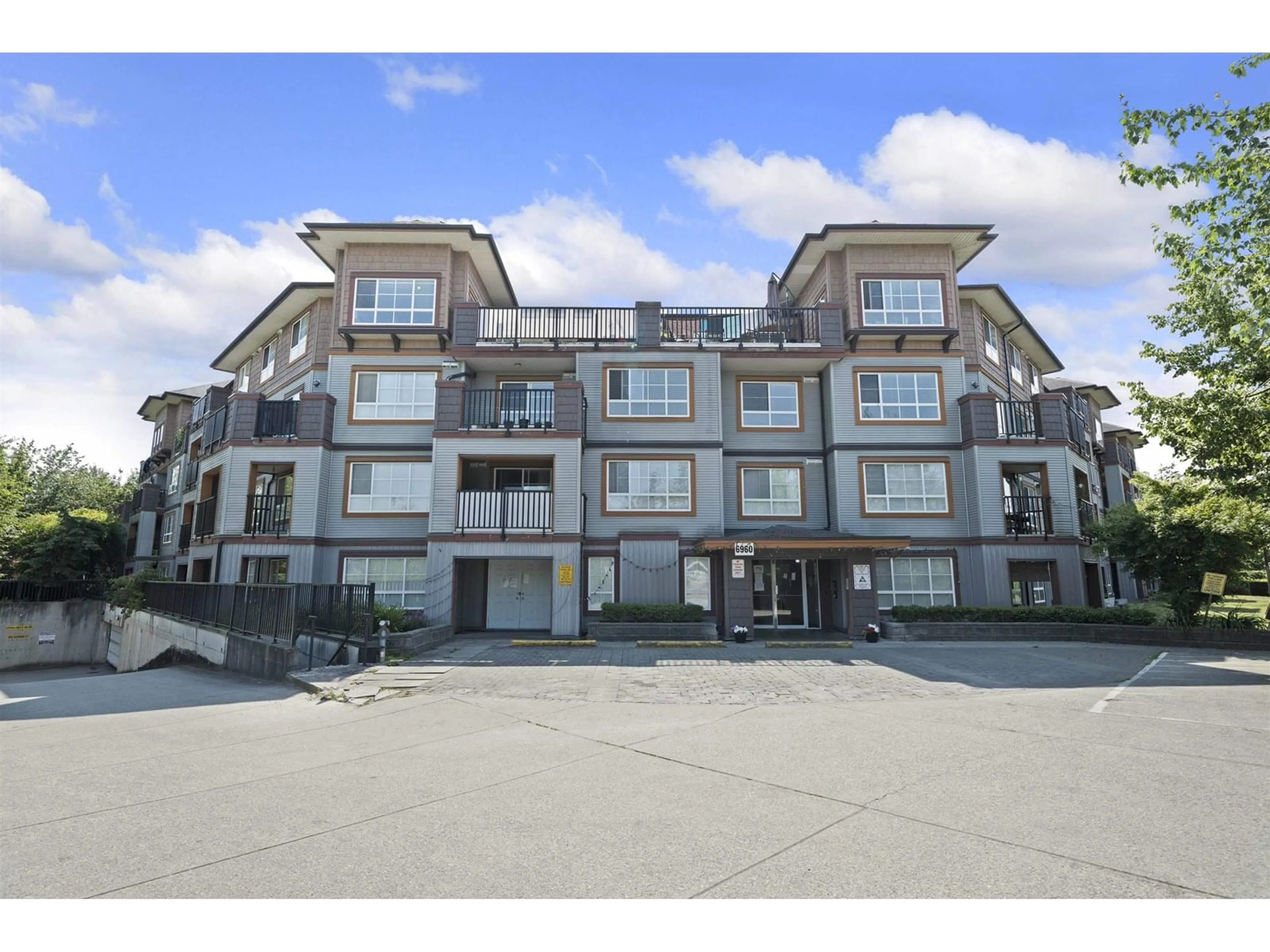 A pic from outside/outdoor area/front of a property/back of a property/a pic from drone, unknown for 409 - 6960 120, Surrey British Columbia V3W1V4