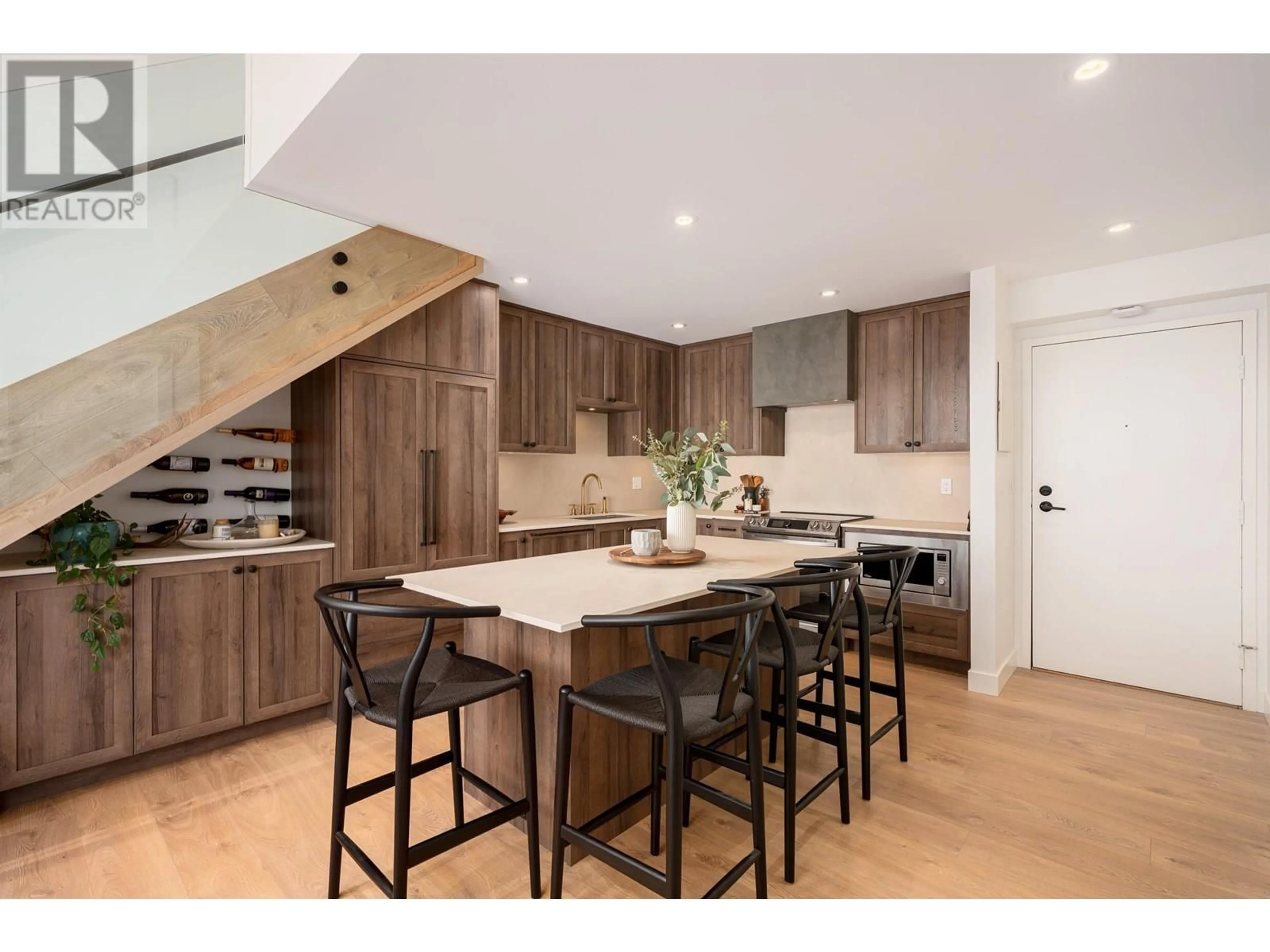 Open concept kitchen, wood/laminate floor for 309 - 2410 CORNWALL AVENUE, Vancouver British Columbia V6K1B8
