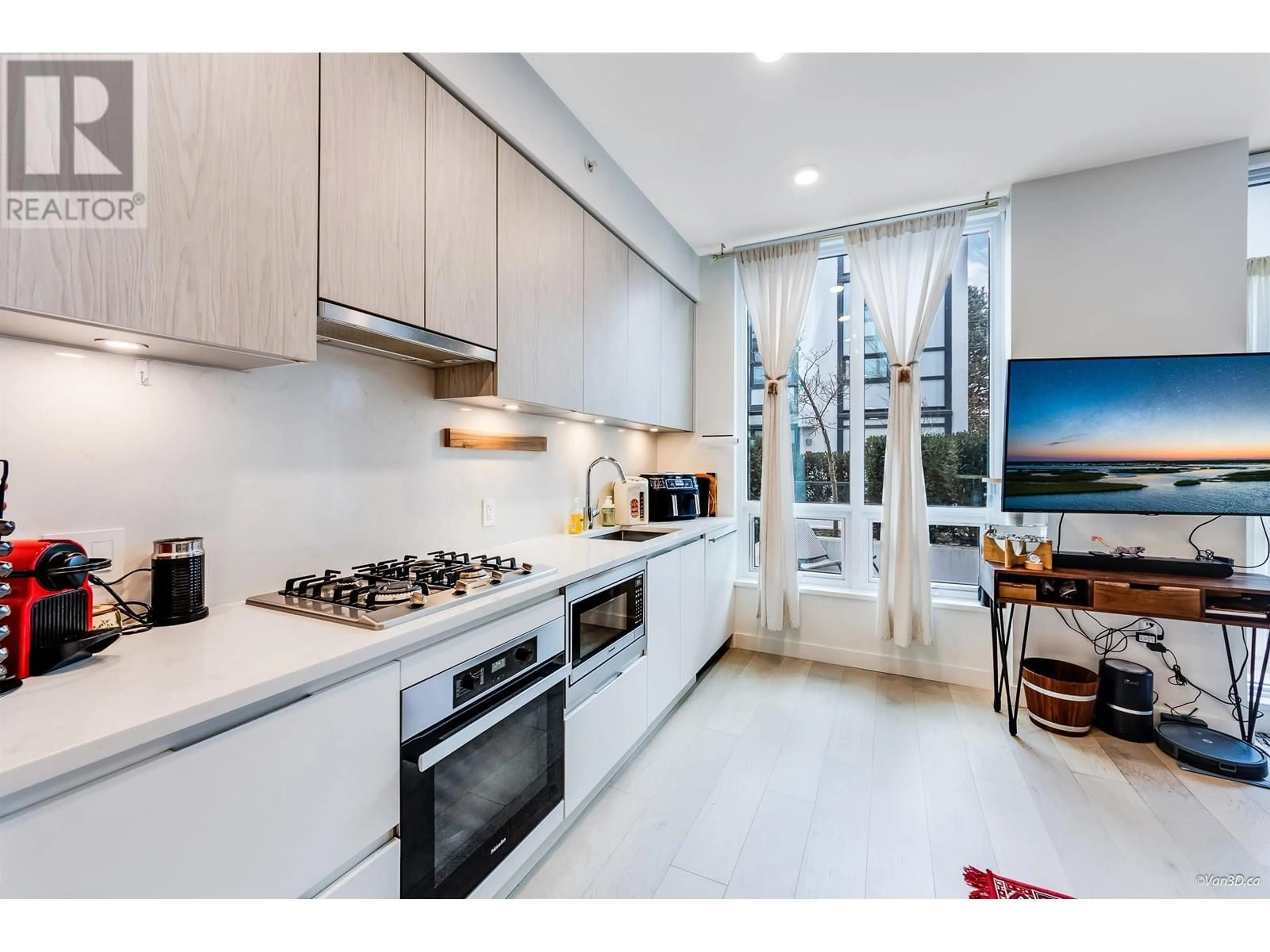 Open concept kitchen, ceramic/tile floor for 102 - 4240 CAMBIE STREET, Vancouver British Columbia V5Z0K6