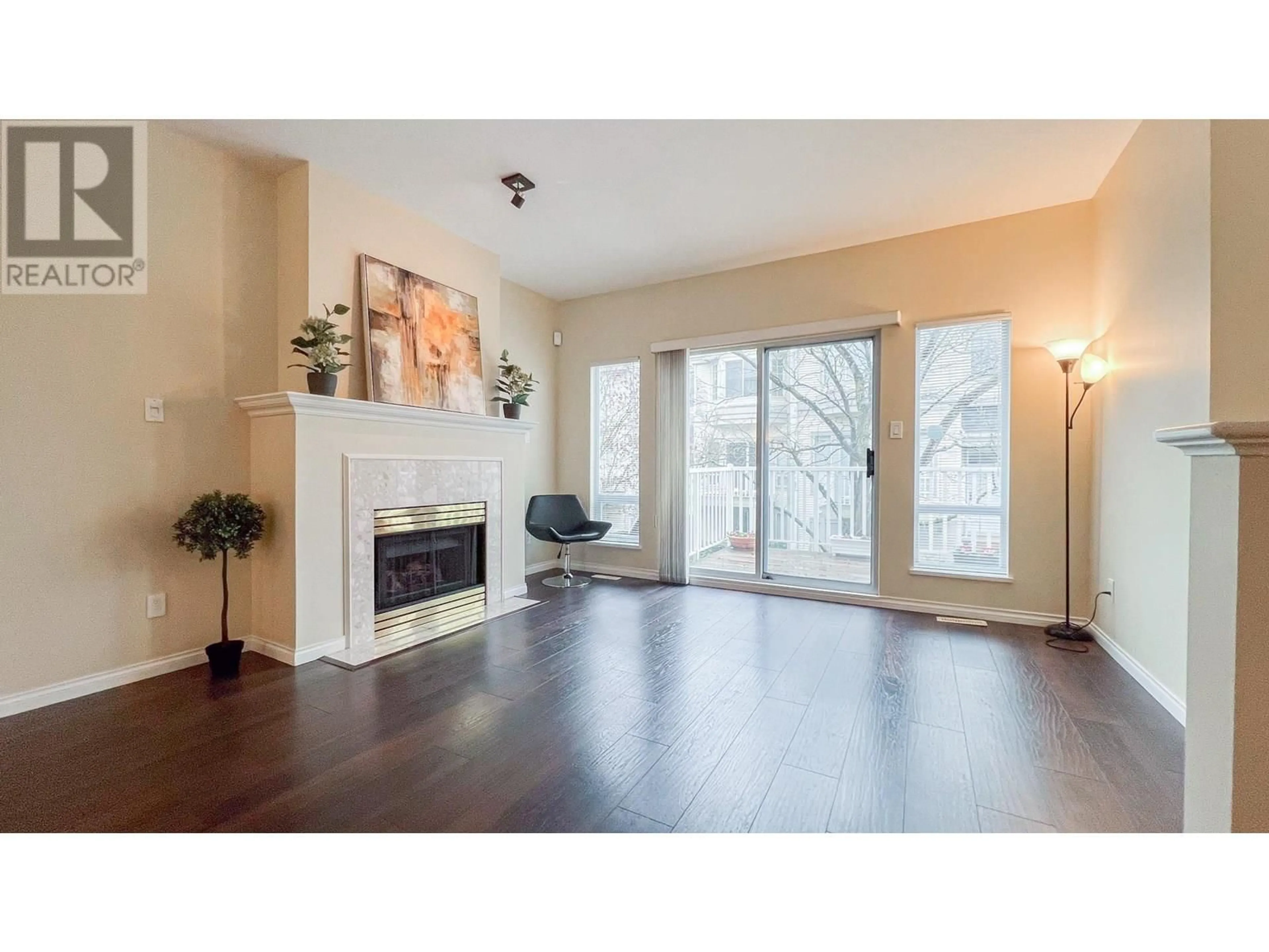 Living room with furniture, wood/laminate floor for 52 - 12891 JACK BELL DRIVE, Richmond British Columbia V6V2T7