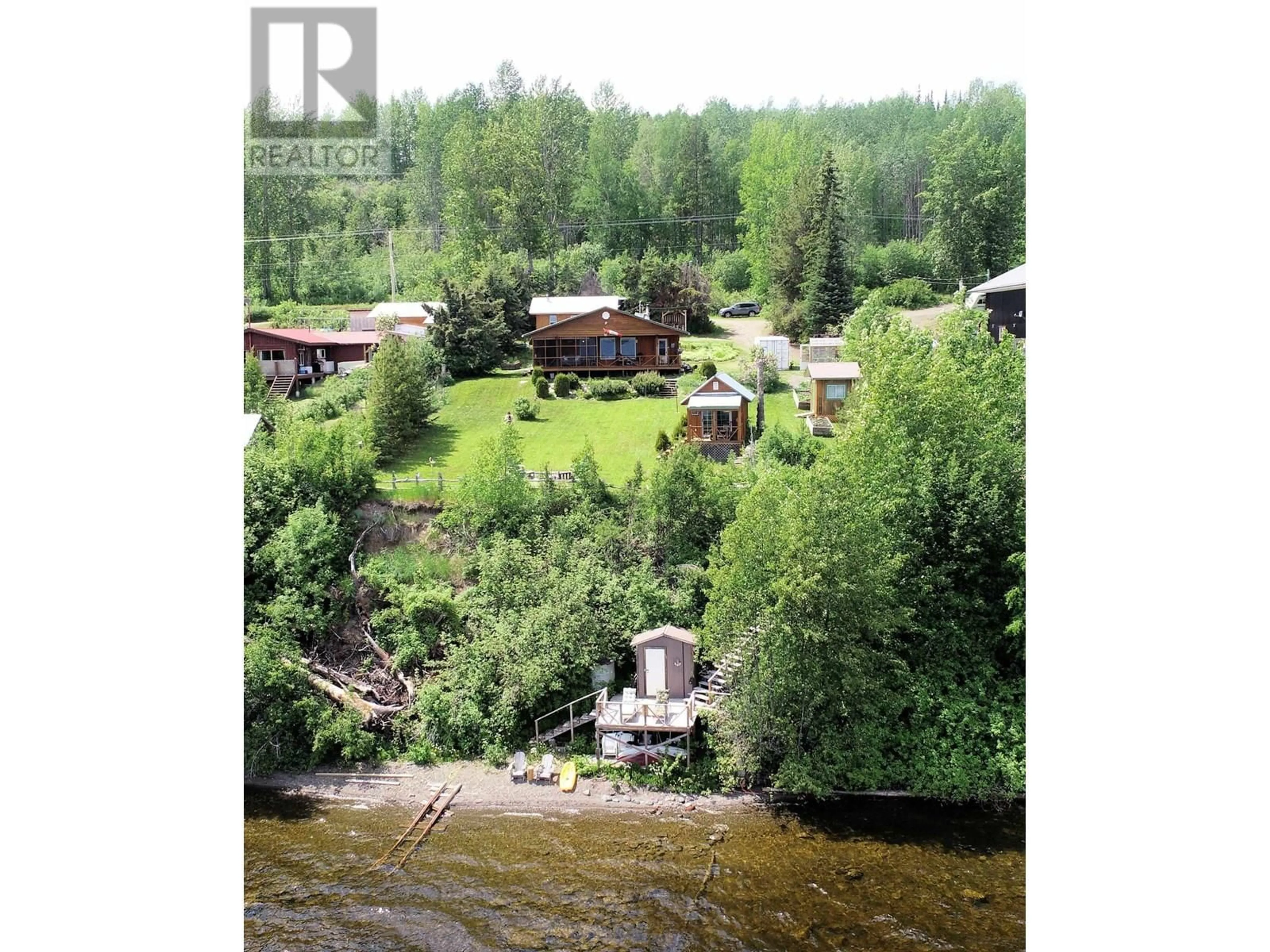 A pic from outside/outdoor area/front of a property/back of a property/a pic from drone, water/lake/river/ocean view for 54456 118 HIGHWAY, Granisle British Columbia V0J1W0