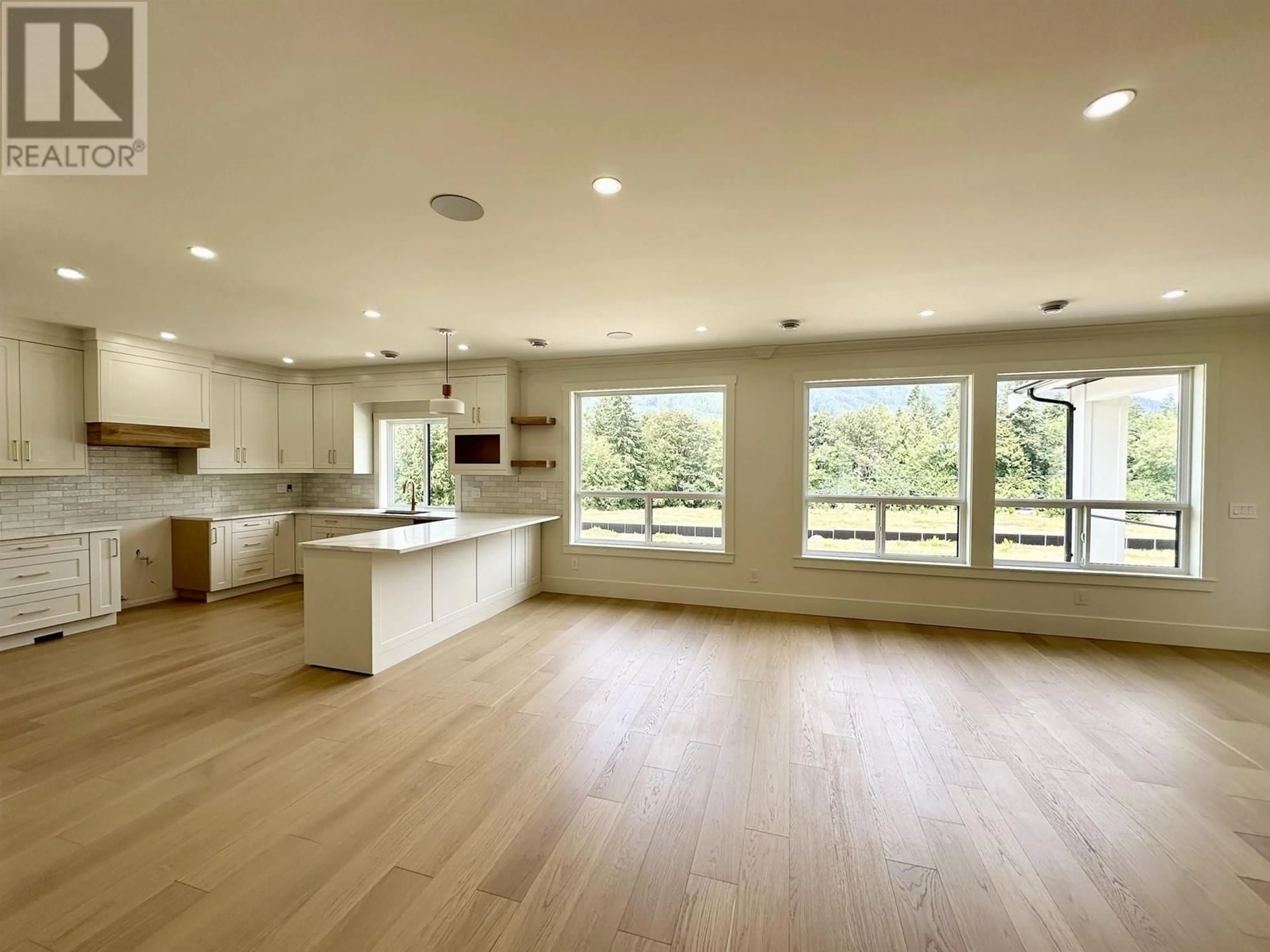 Open concept kitchen, wood/laminate floor for 1203 CASTLE ROAD, Gibsons British Columbia V0N1V5