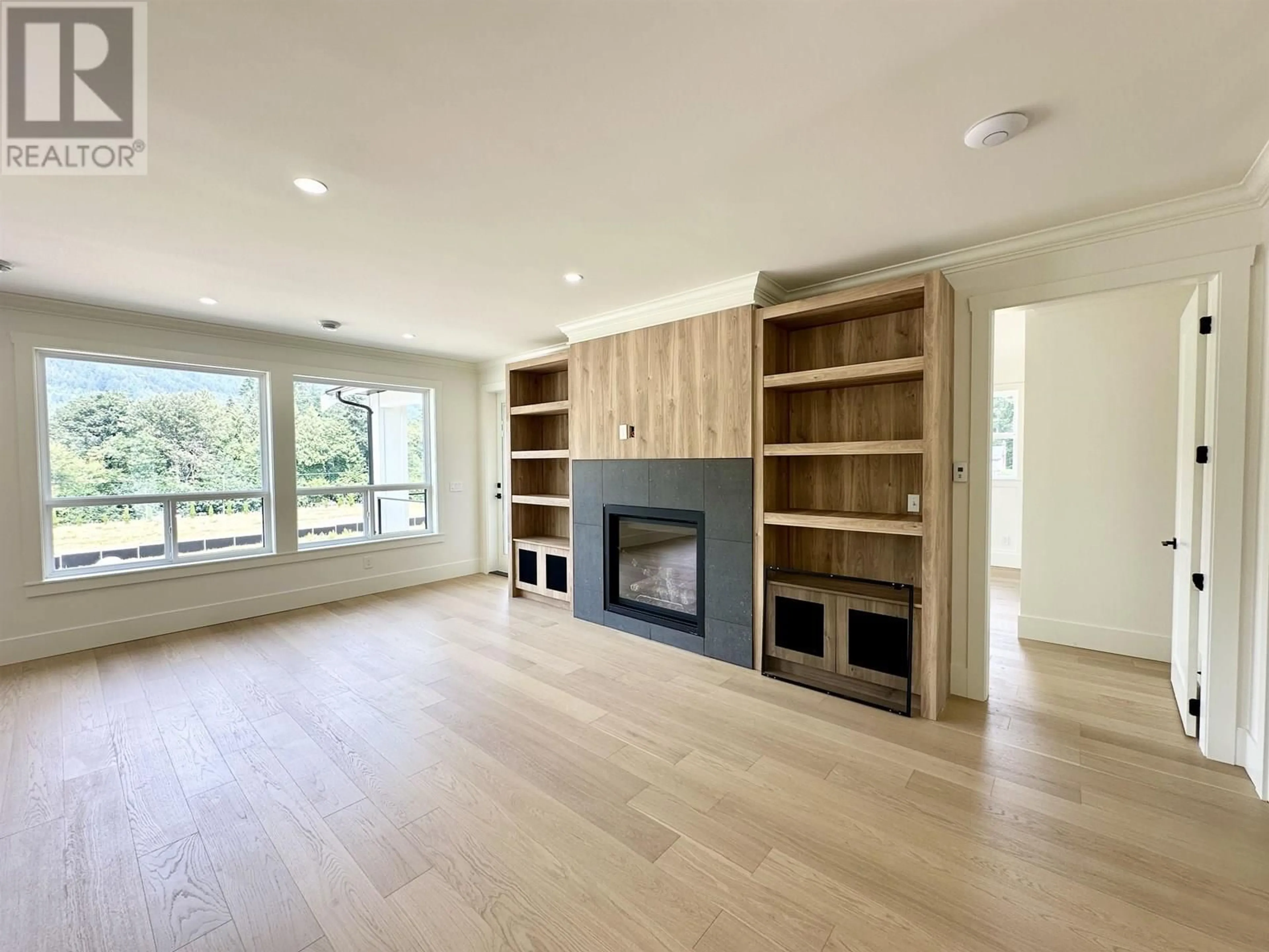Living room with furniture, wood/laminate floor for 1203 CASTLE ROAD, Gibsons British Columbia V0N1V5