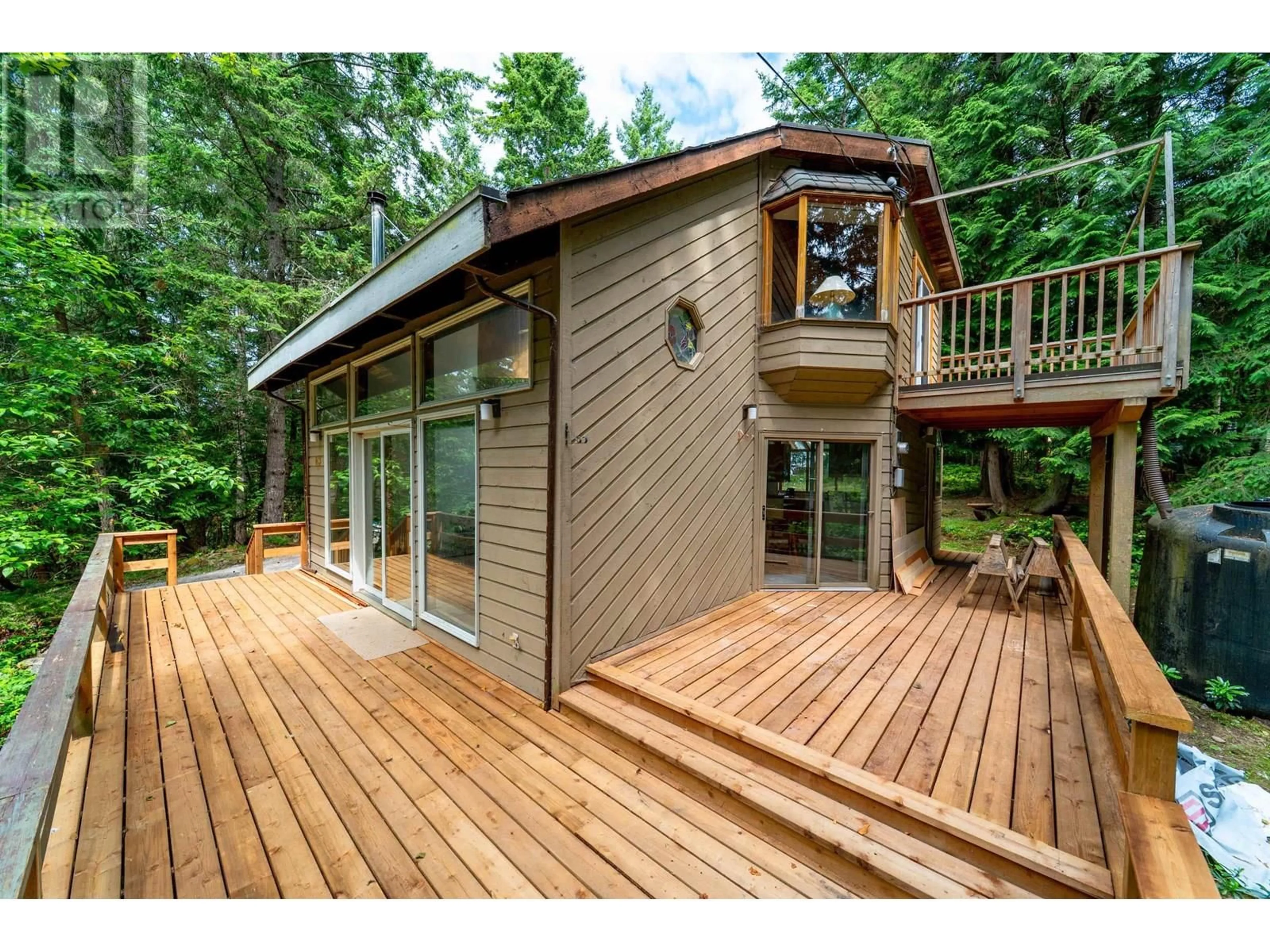 Home with vinyl exterior material, forest/trees view for 163 SPINNAKER, Mayne Island British Columbia V0N2J2