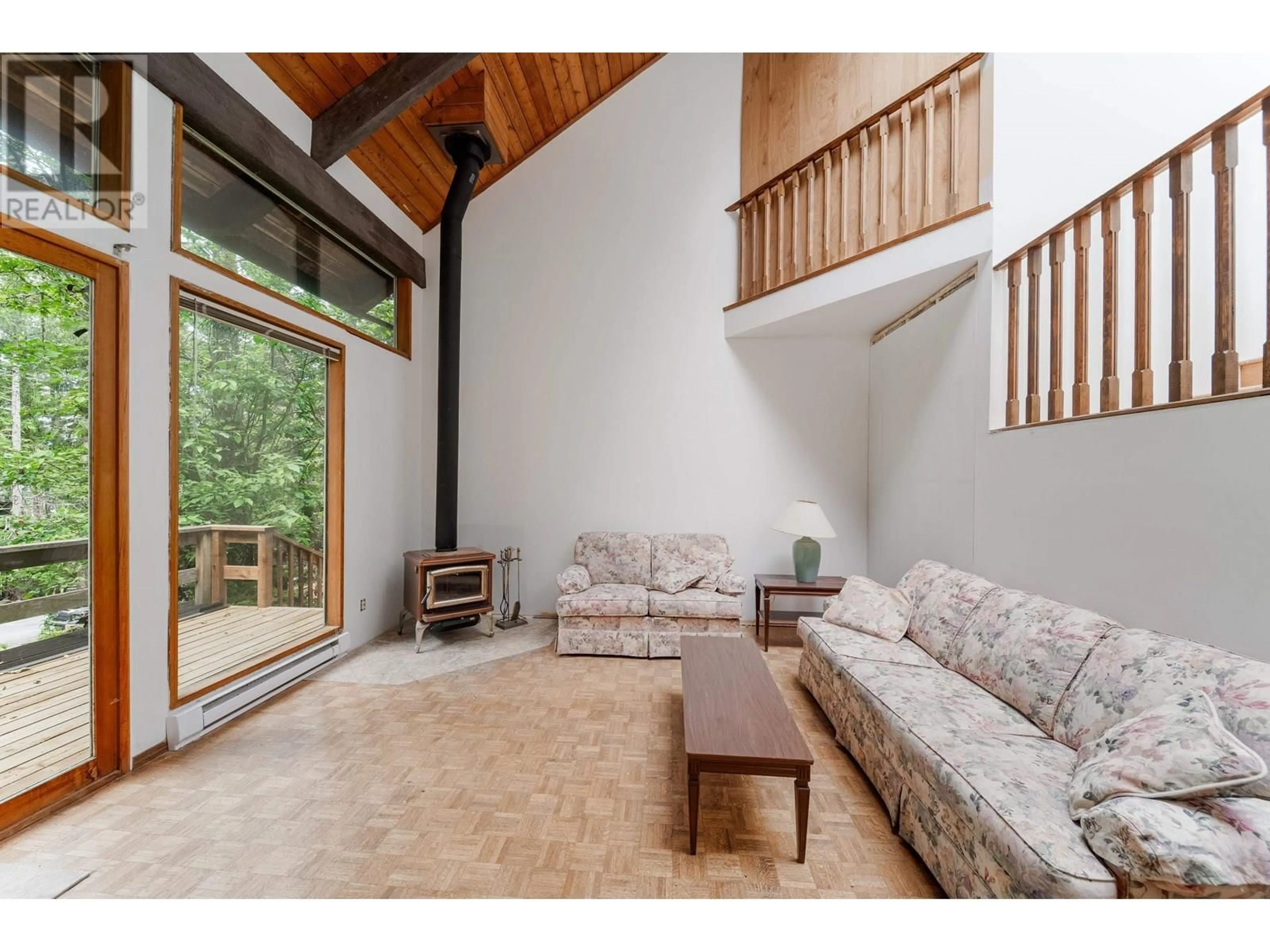 Living room with furniture, wood/laminate floor for 163 SPINNAKER, Mayne Island British Columbia V0N2J2