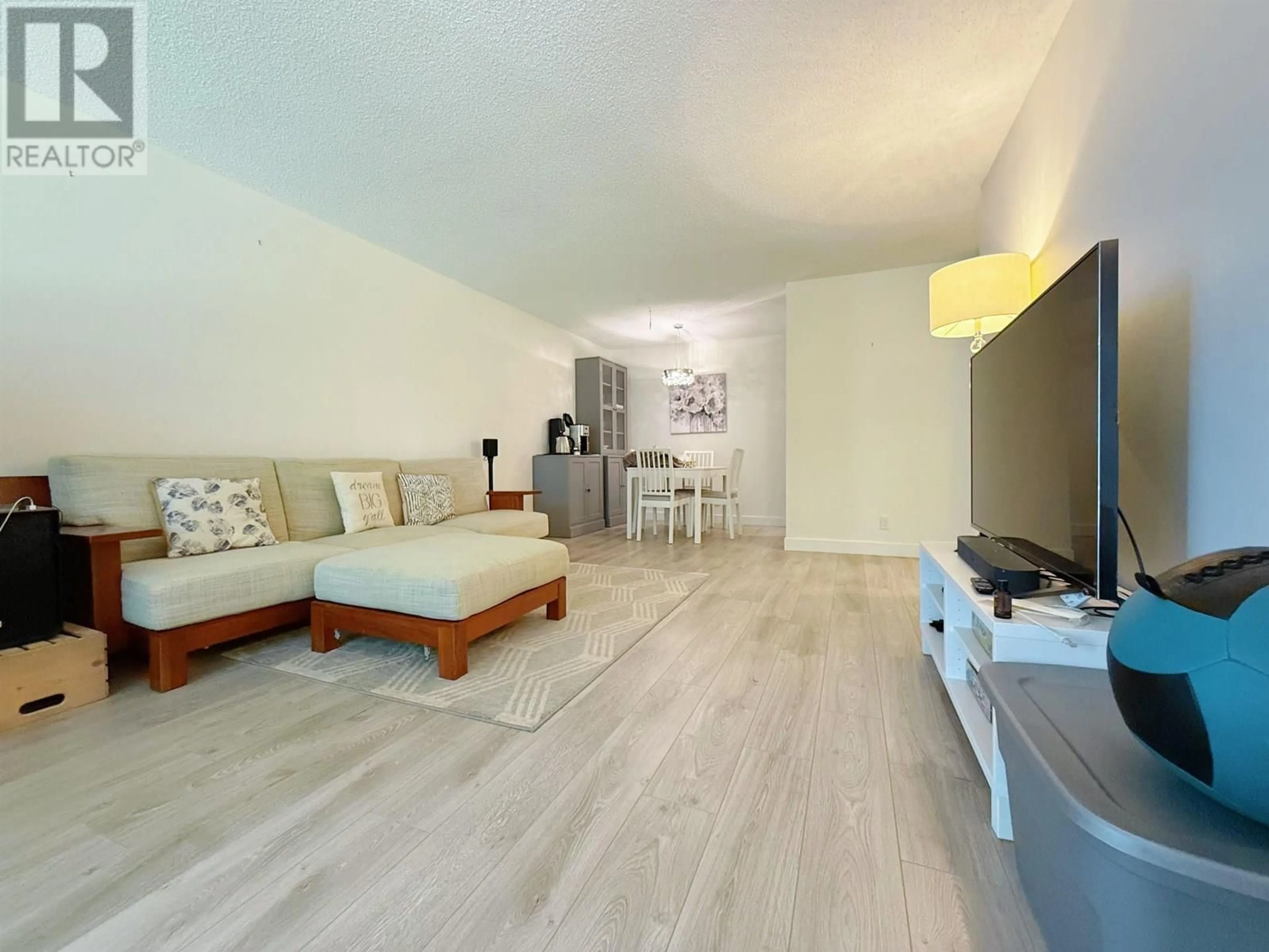 Living room with furniture, wood/laminate floor for 209 - 5411 ARCADIA ROAD, Richmond British Columbia V6X2H1