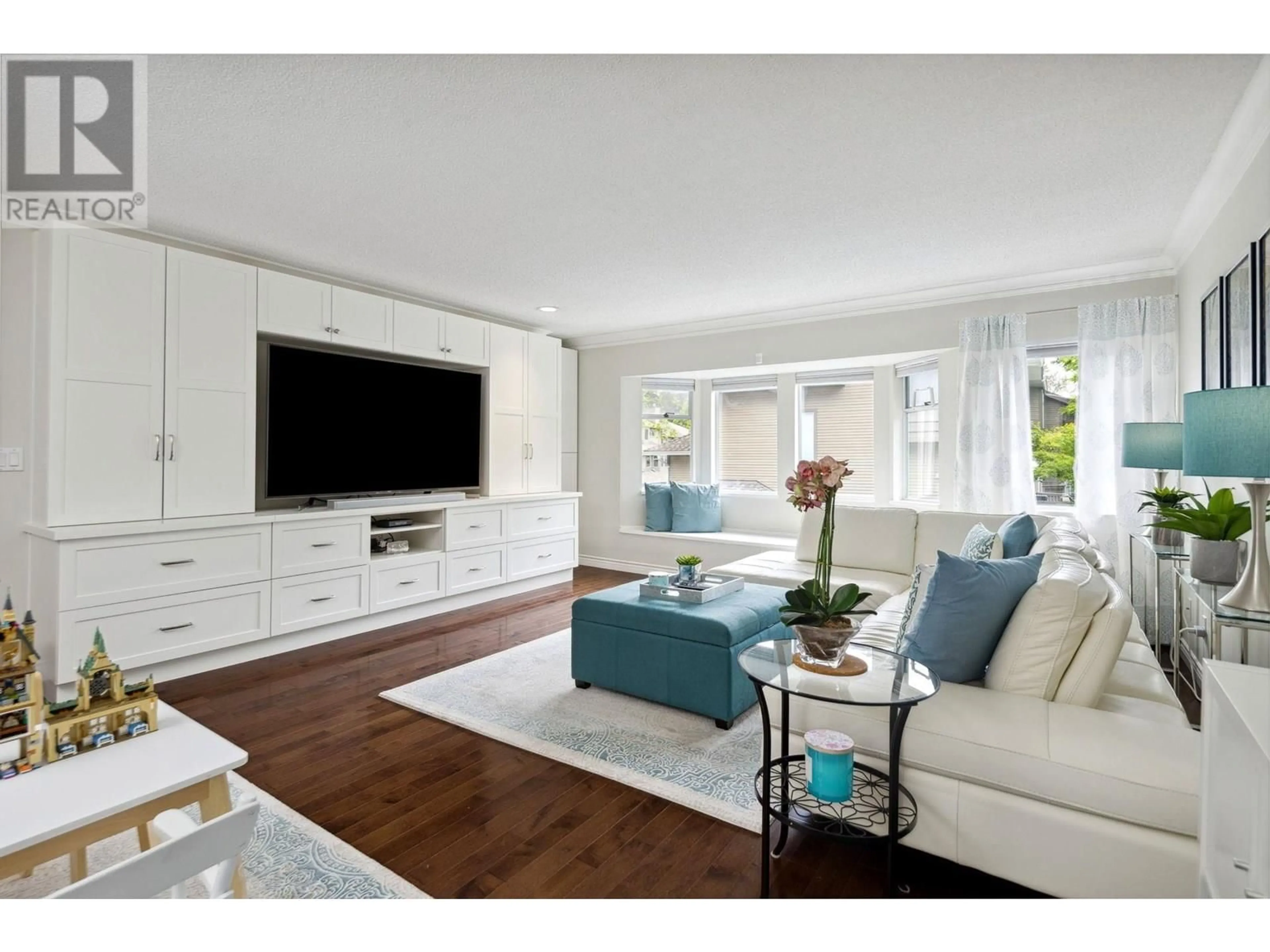 Living room with furniture, wood/laminate floor for 8893 LARKFIELD DRIVE, Burnaby British Columbia V5A4L3