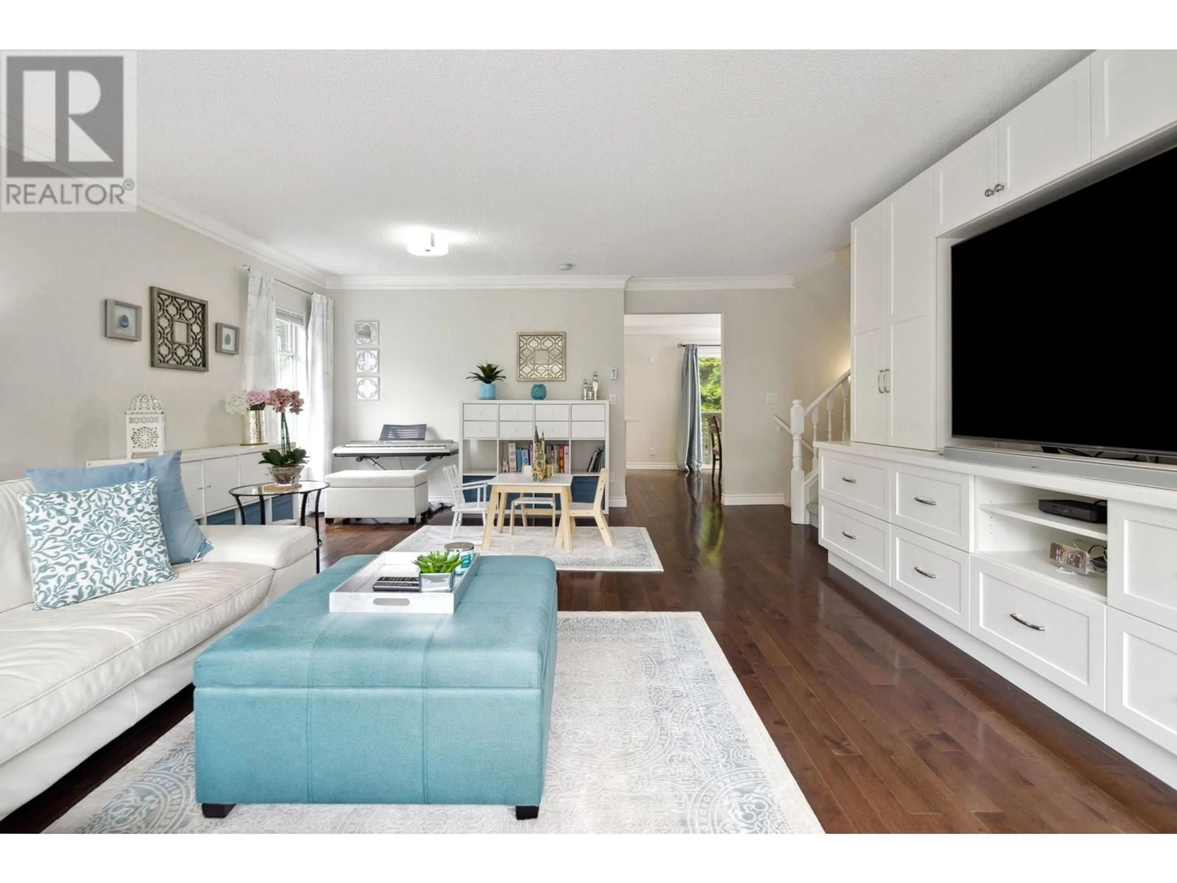 Living room with furniture, wood/laminate floor for 8893 LARKFIELD DRIVE, Burnaby British Columbia V5A4L3