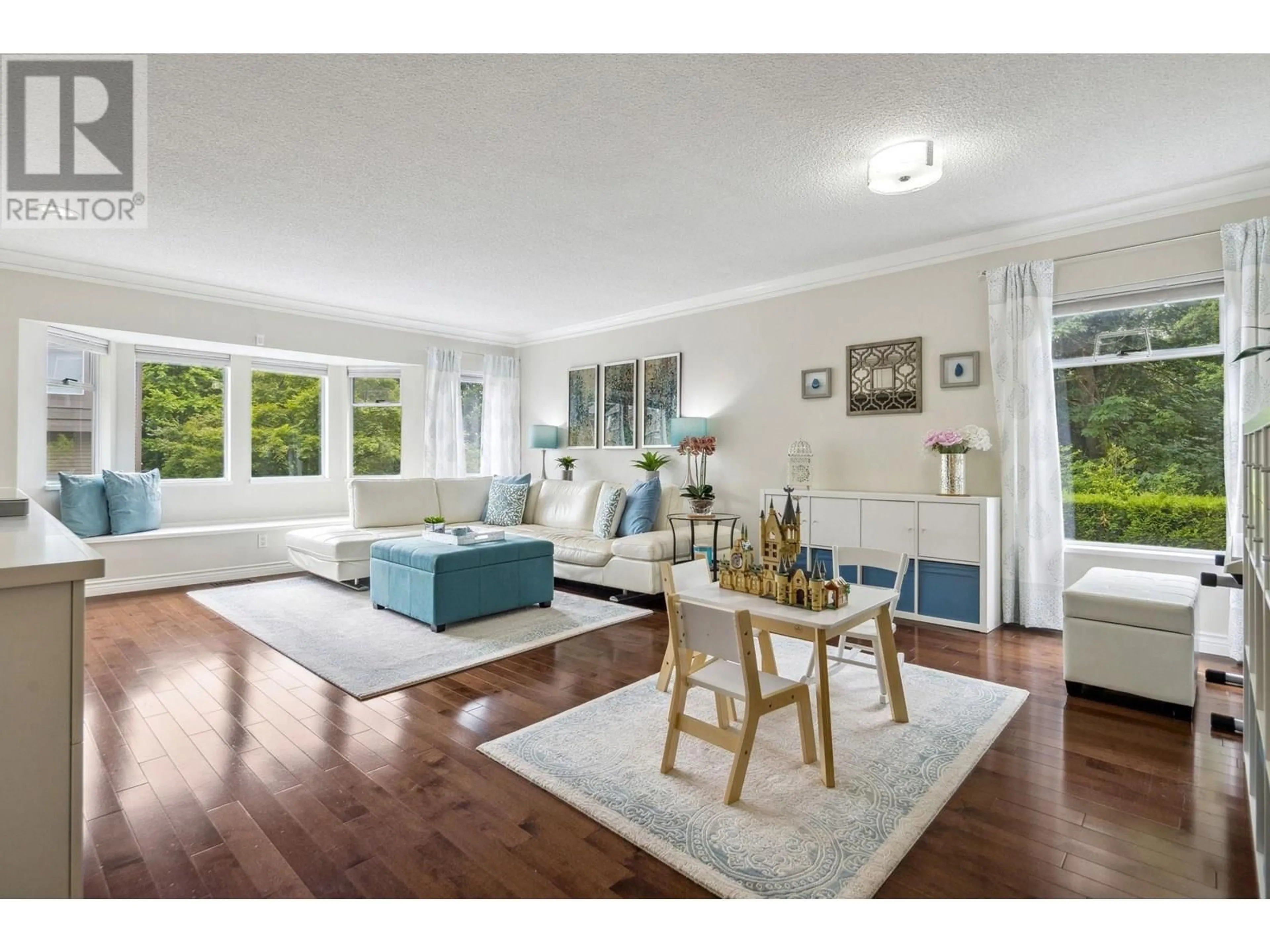 Living room with furniture, wood/laminate floor for 8893 LARKFIELD DRIVE, Burnaby British Columbia V5A4L3