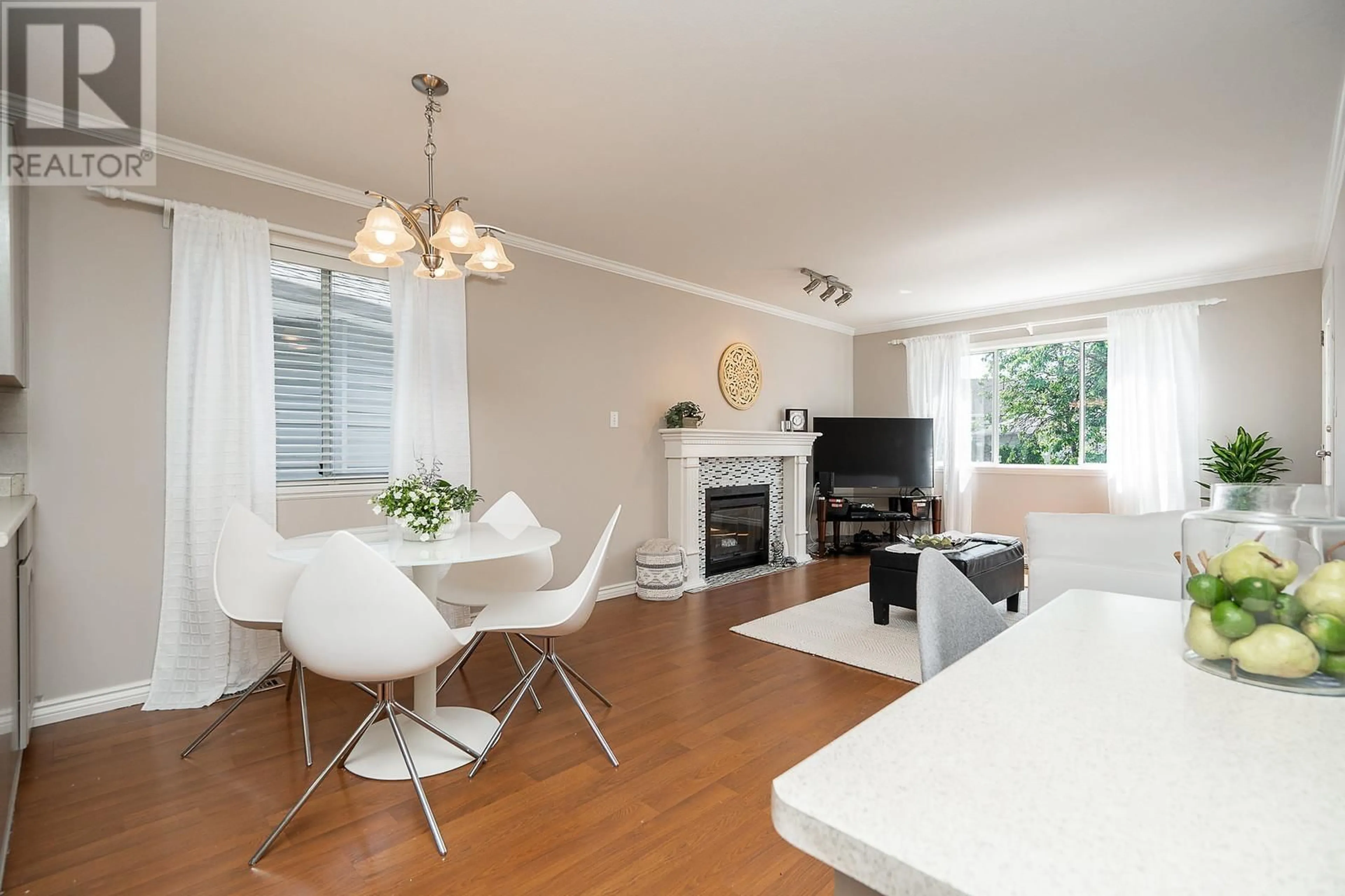 Living room with furniture, wood/laminate floor for 1932 JACANA AVENUE, Port Coquitlam British Columbia V3C5Y4