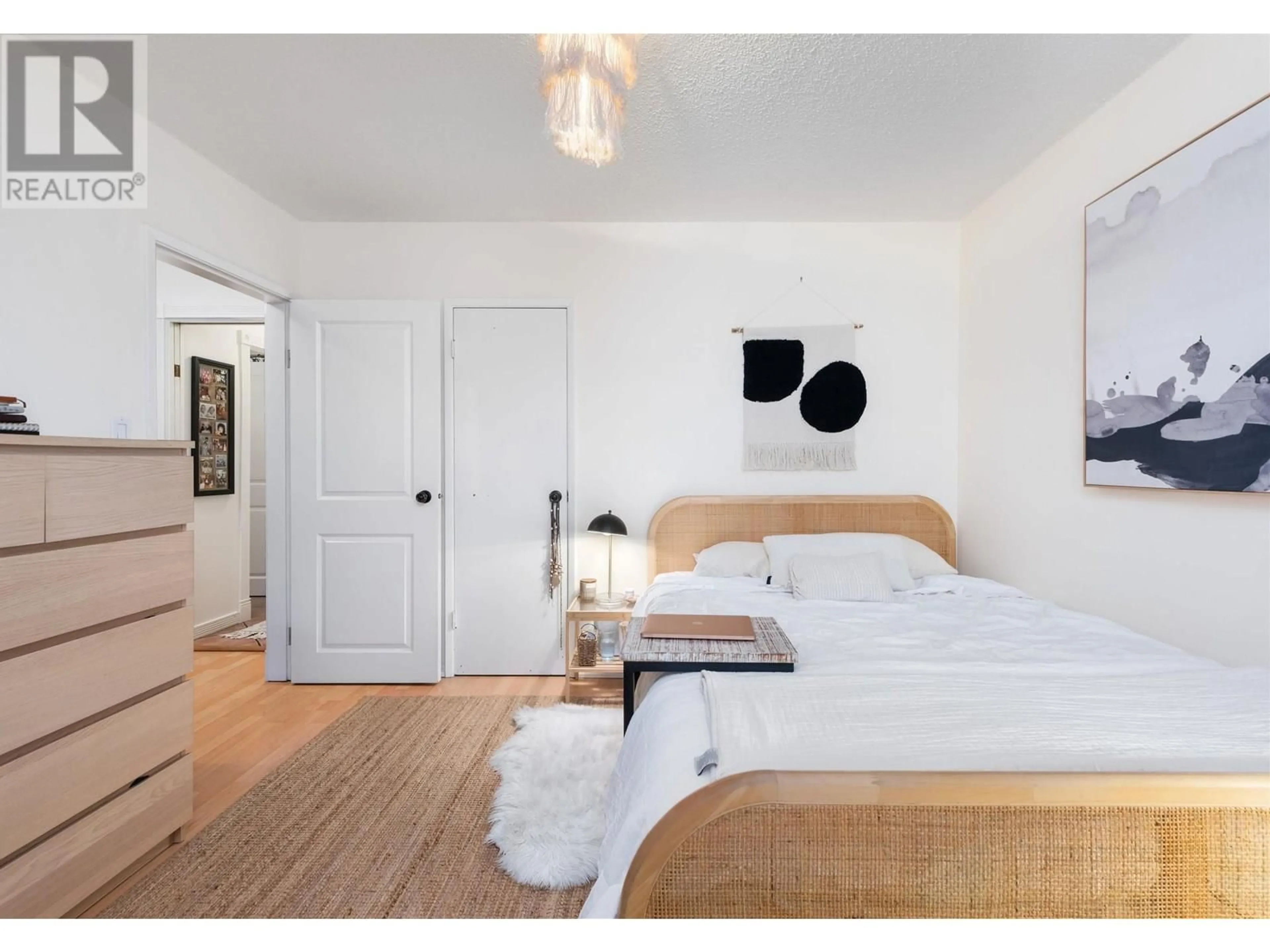Bedroom with bed, wood/laminate floor for 2590 GEORGIA STREET, Vancouver British Columbia V5K2J7
