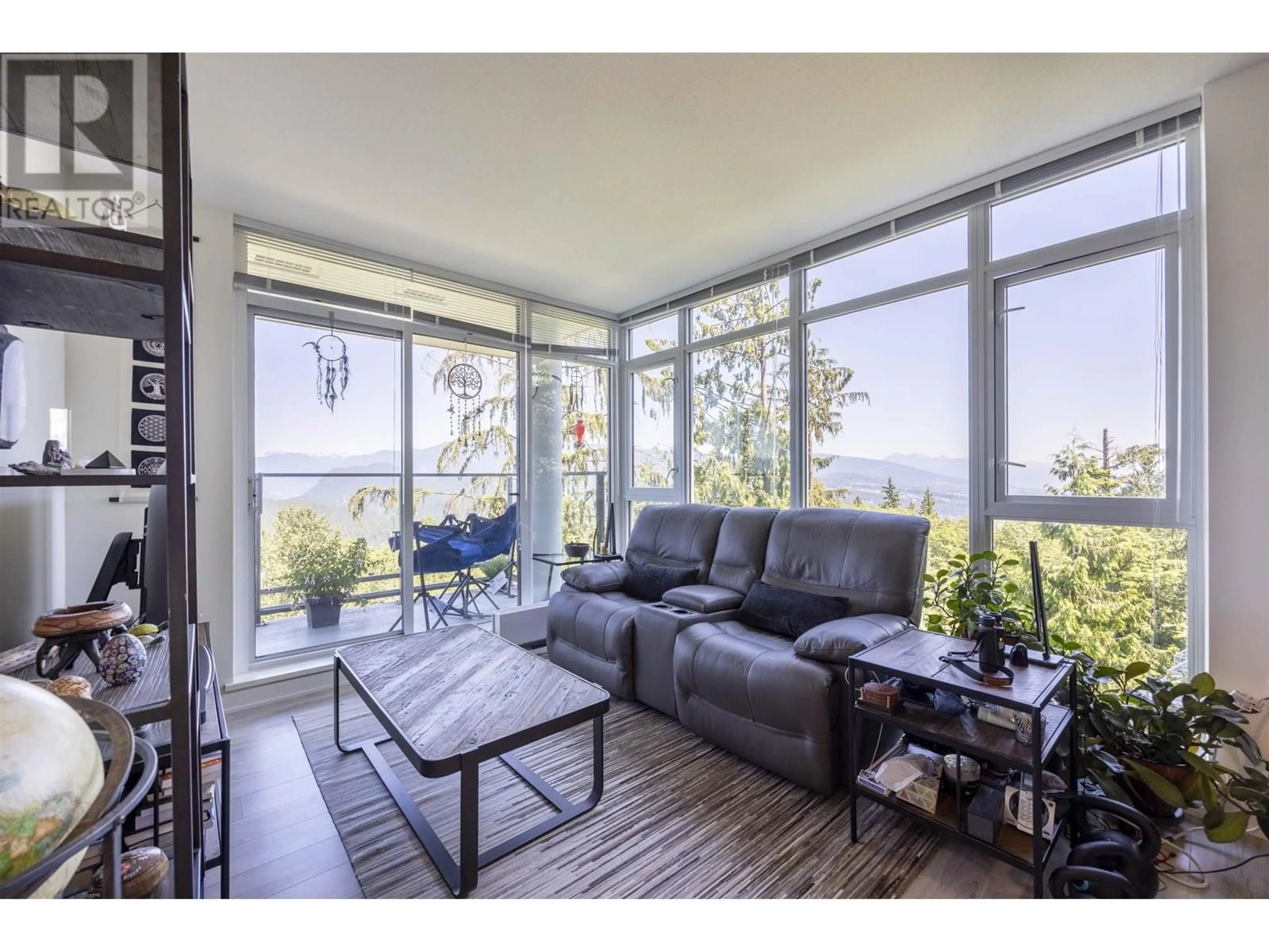 Living room with furniture, wood/laminate floor for 709 - 8940 UNIVERSITY CRESCENT, Burnaby British Columbia V5A0E7
