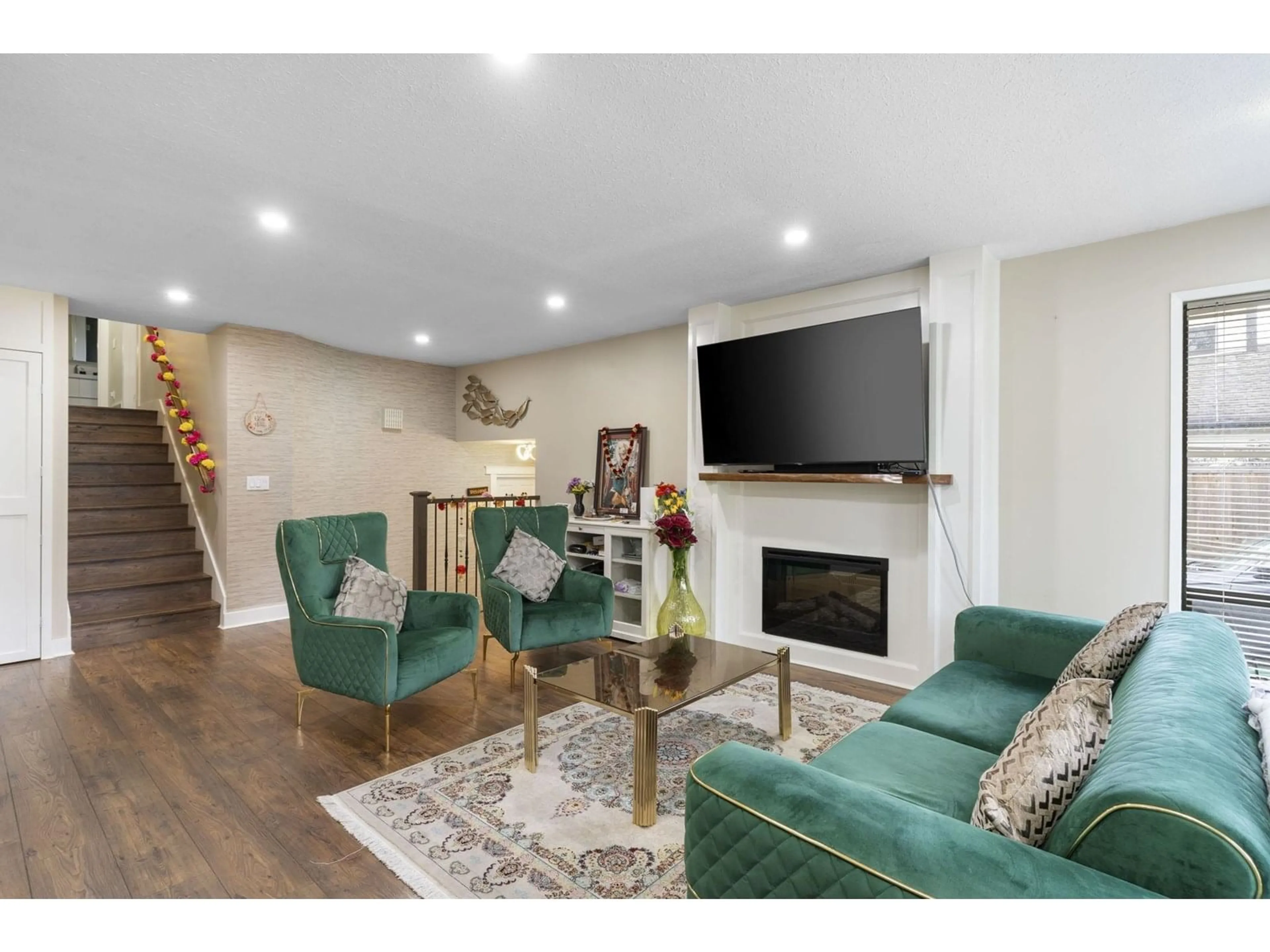 Living room with furniture, wood/laminate floor for 19745 48A, Langley British Columbia V3A4W2
