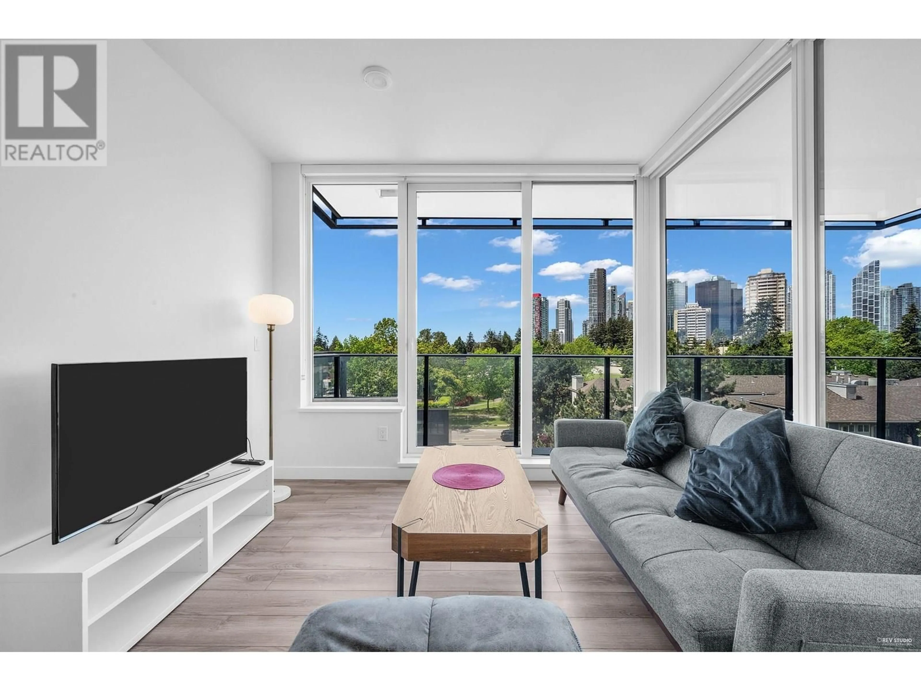Living room with furniture, wood/laminate floor for 502 - 6699 DUNBLANE AVENUE, Burnaby British Columbia V5H0J8