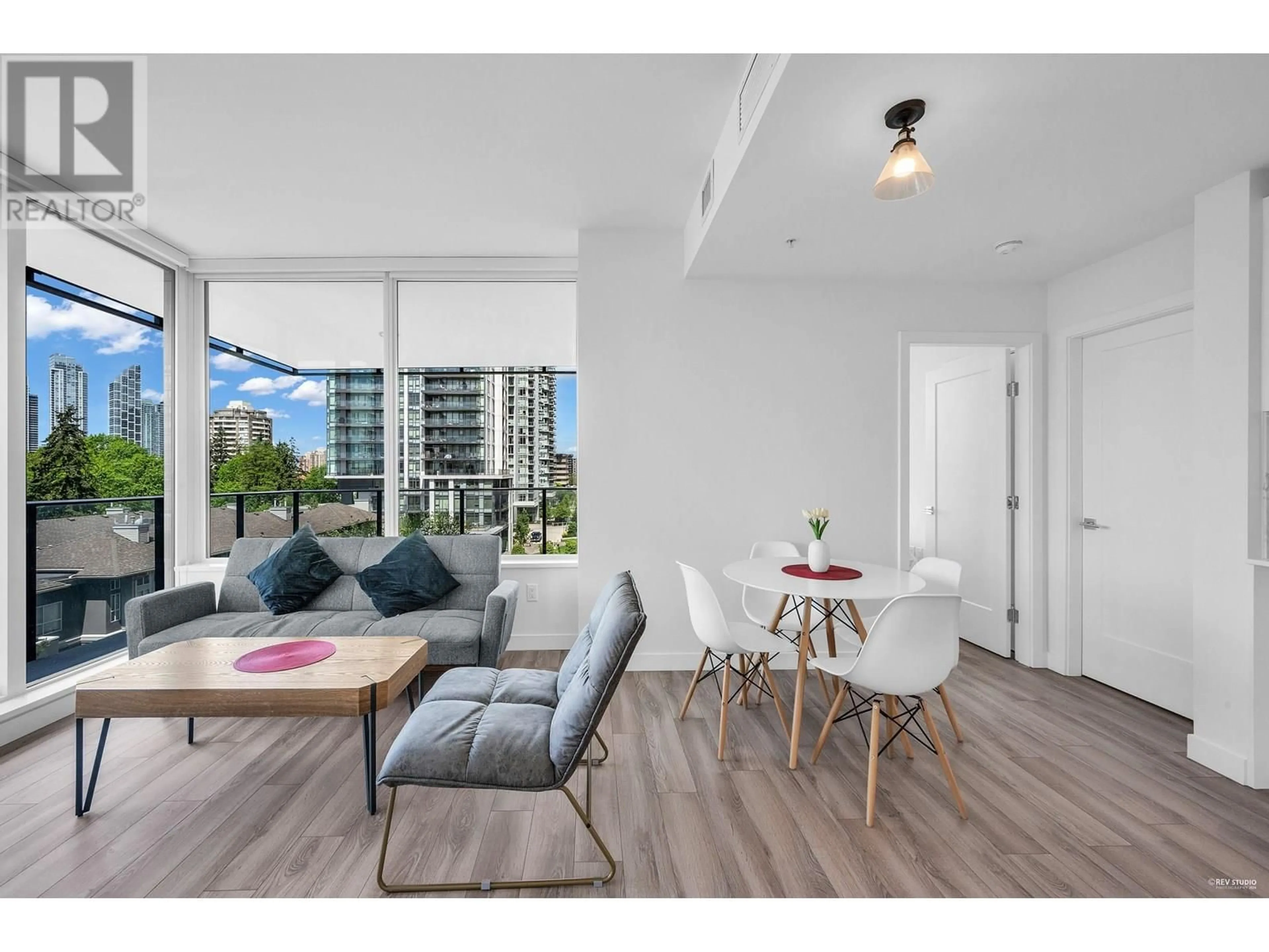 Living room with furniture, wood/laminate floor for 502 - 6699 DUNBLANE AVENUE, Burnaby British Columbia V5H0J8
