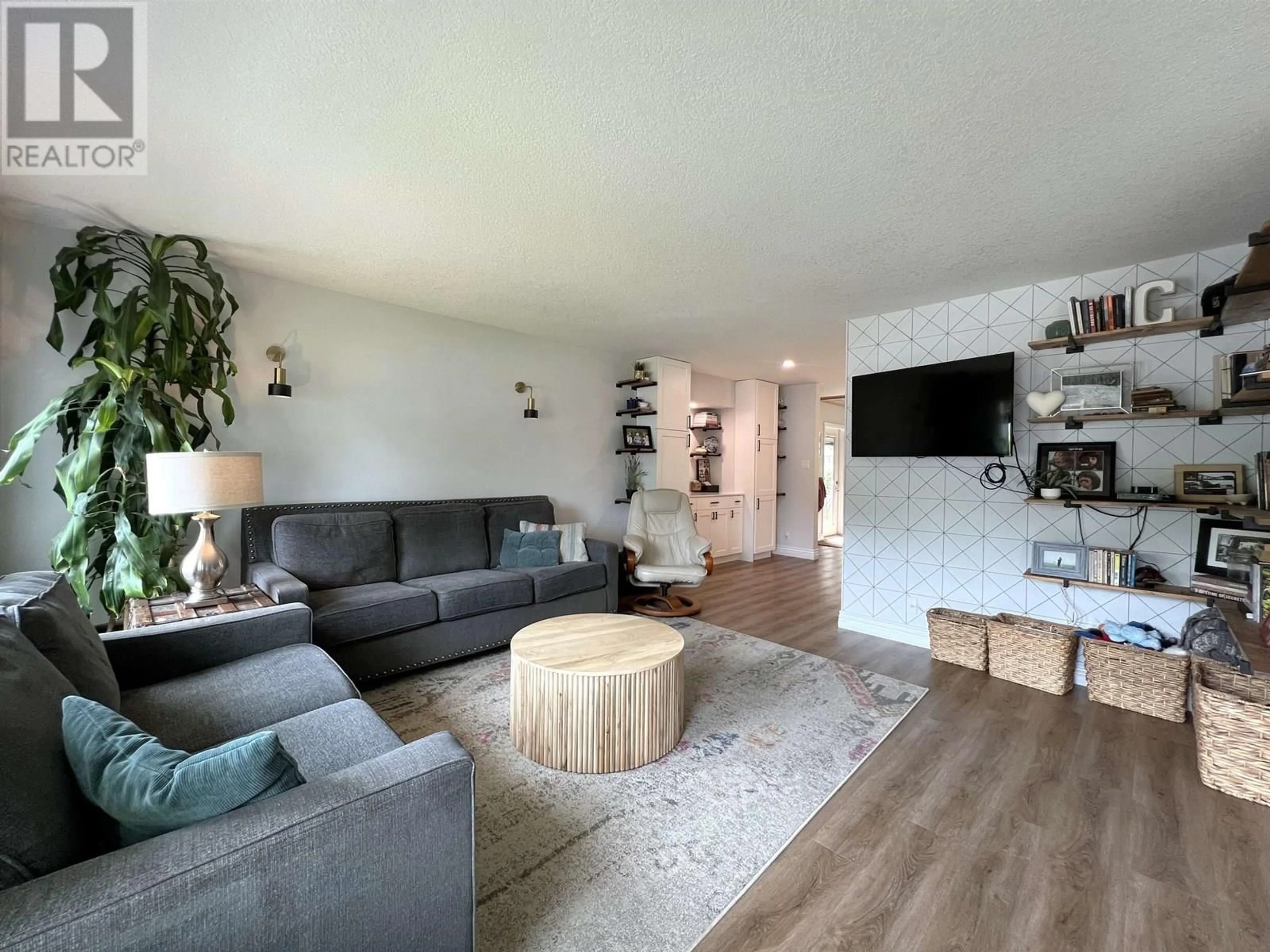 Living room with furniture, wood/laminate floor for 7559 ST KEVIN PLACE, Prince George British Columbia V2N4L3