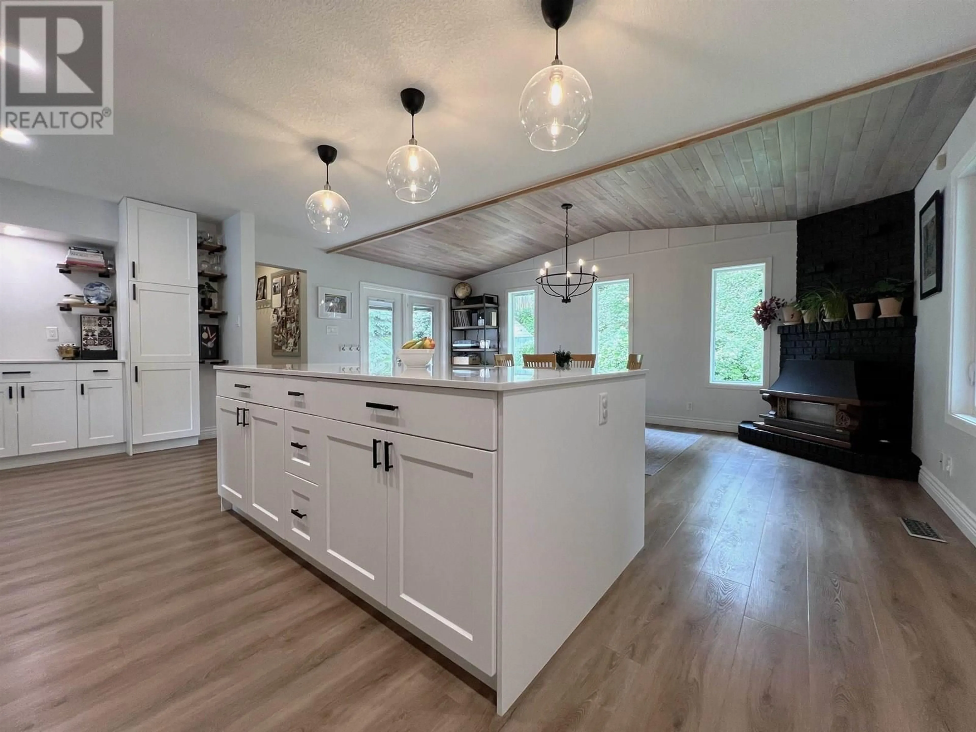 Open concept kitchen, wood/laminate floor for 7559 ST KEVIN PLACE, Prince George British Columbia V2N4L3