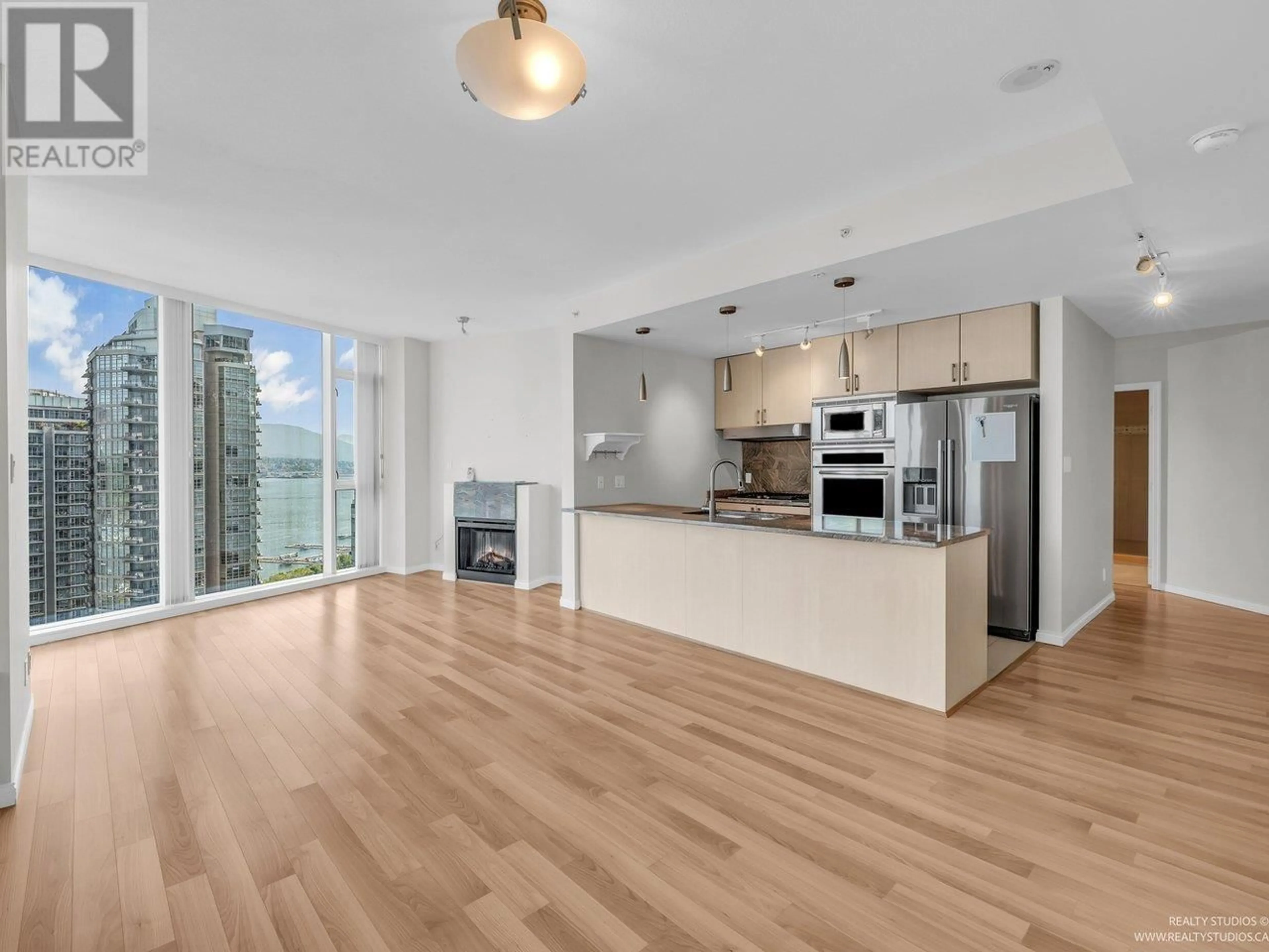 Open concept kitchen, wood/laminate floor for 1905 - 1211 MELVILLE STREET, Vancouver British Columbia V6E0A7