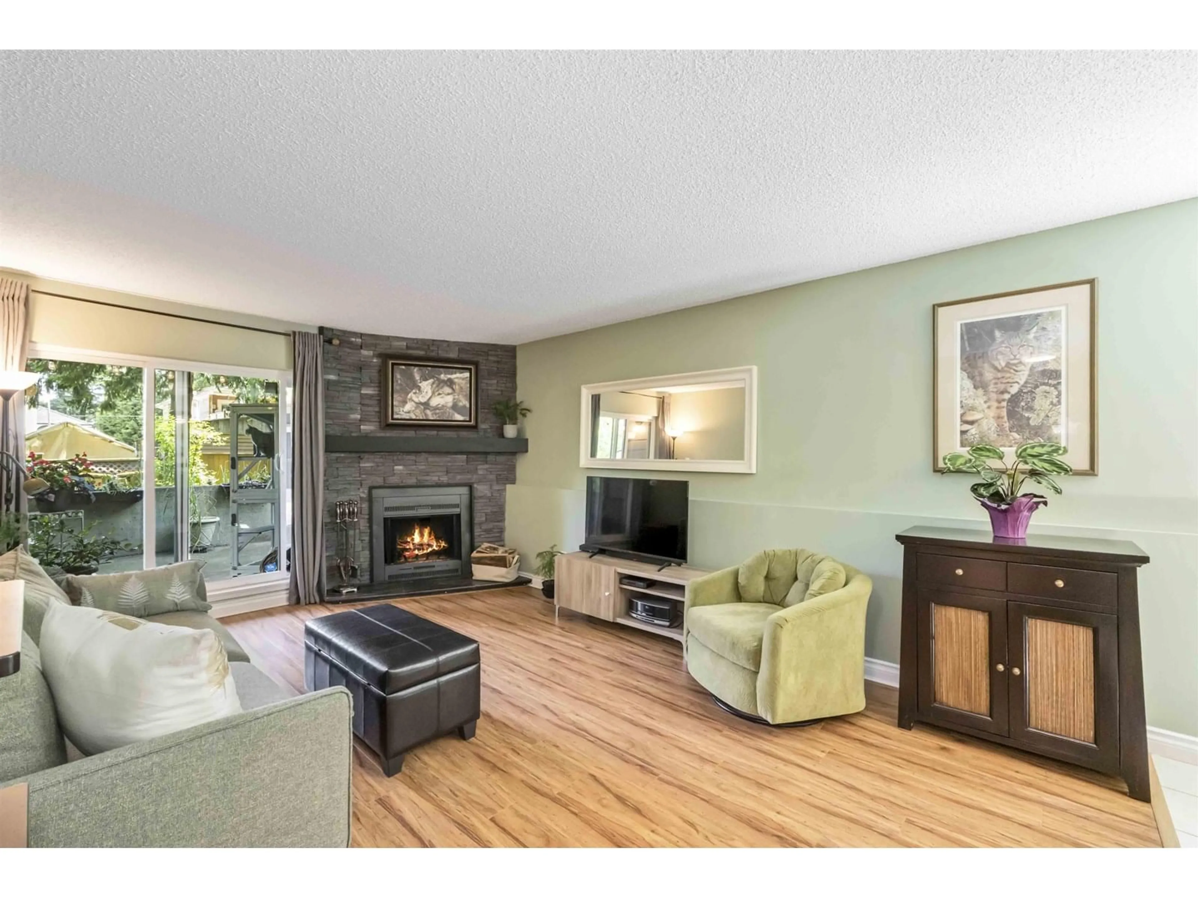 Living room with furniture, wood/laminate floor for 104 - 10560 154TH, Surrey British Columbia V3R8A3