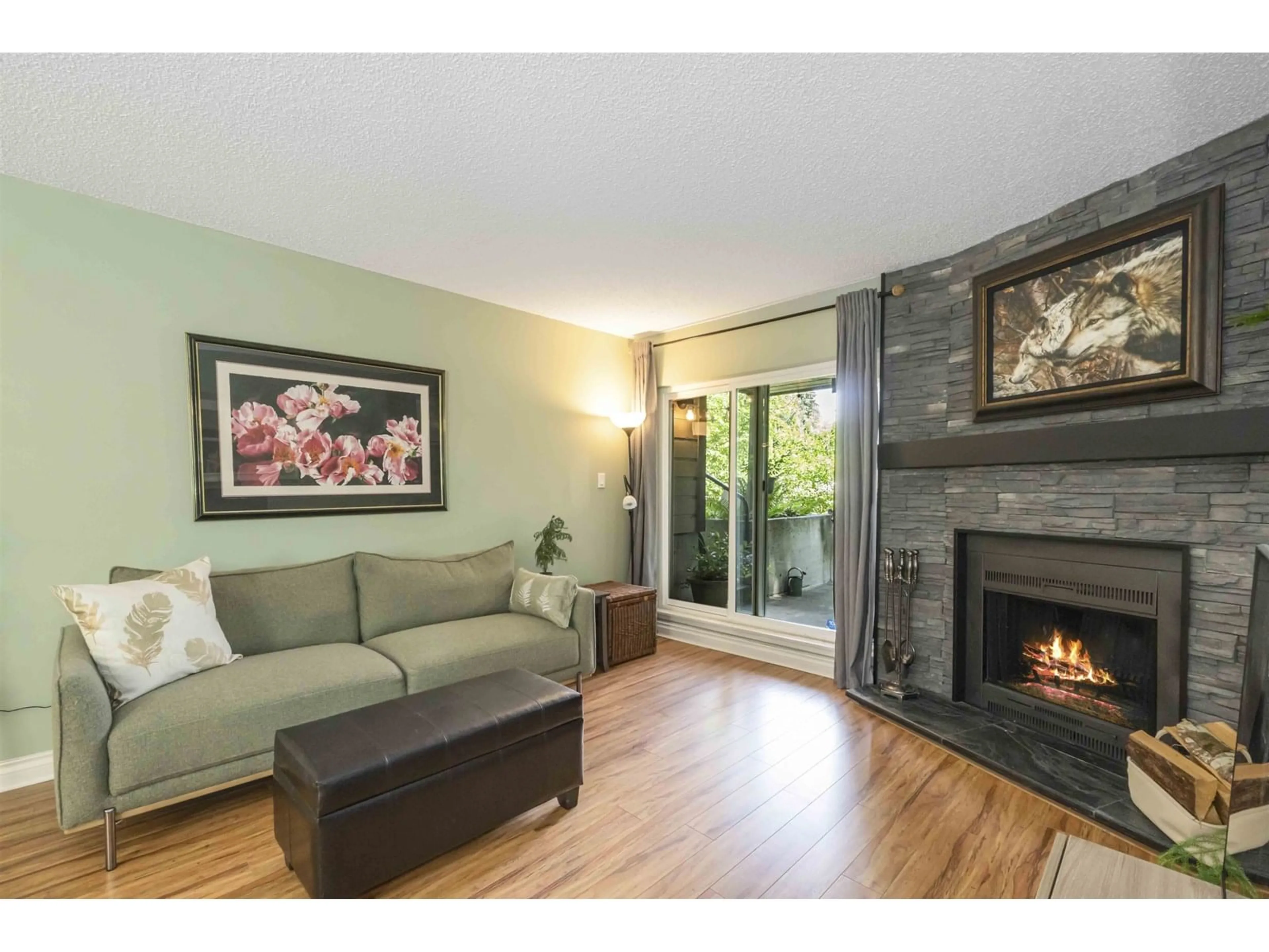 Living room with furniture, wood/laminate floor for 104 - 10560 154TH, Surrey British Columbia V3R8A3