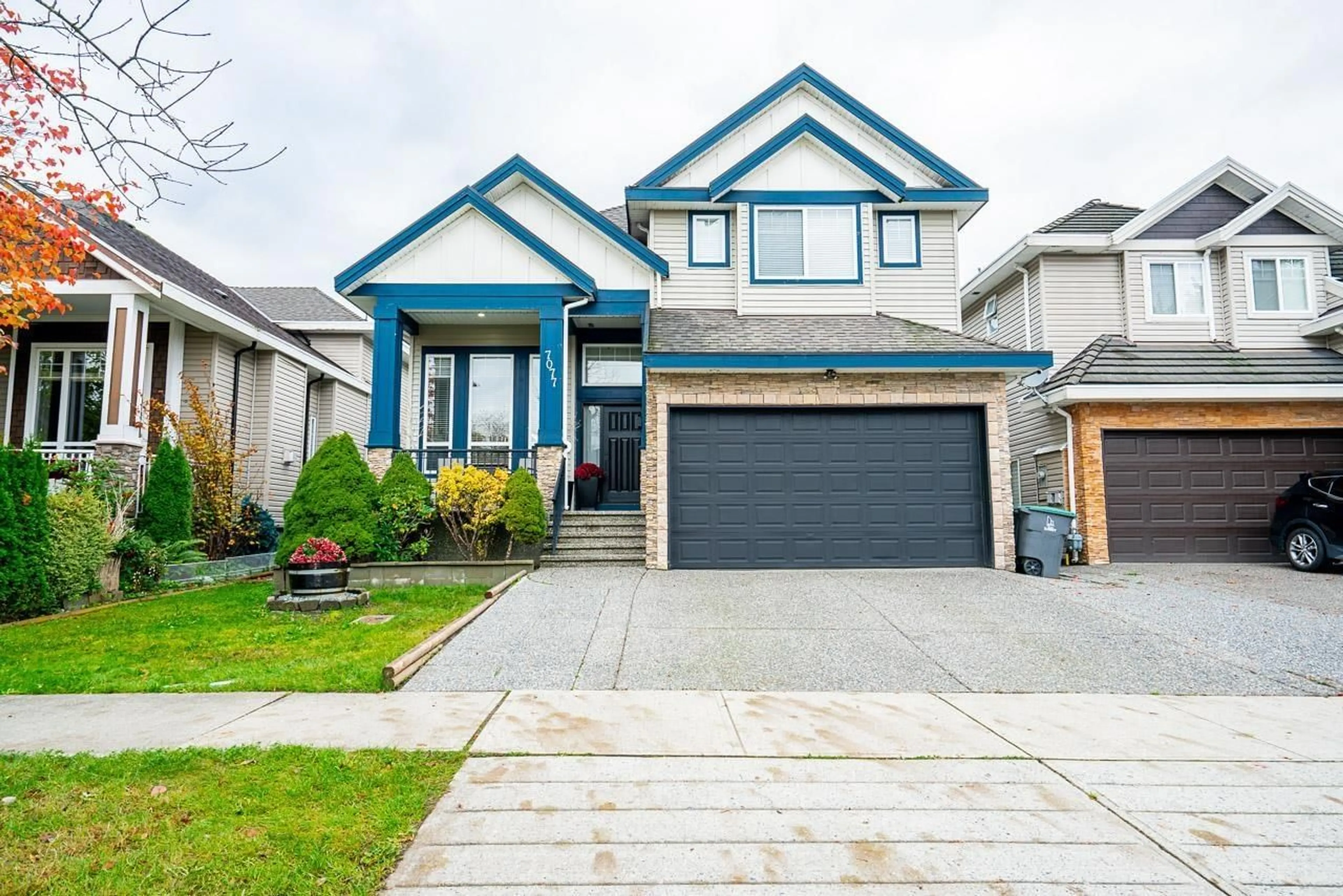 Home with vinyl exterior material, street for 7077 149A, Surrey British Columbia V3S1K2