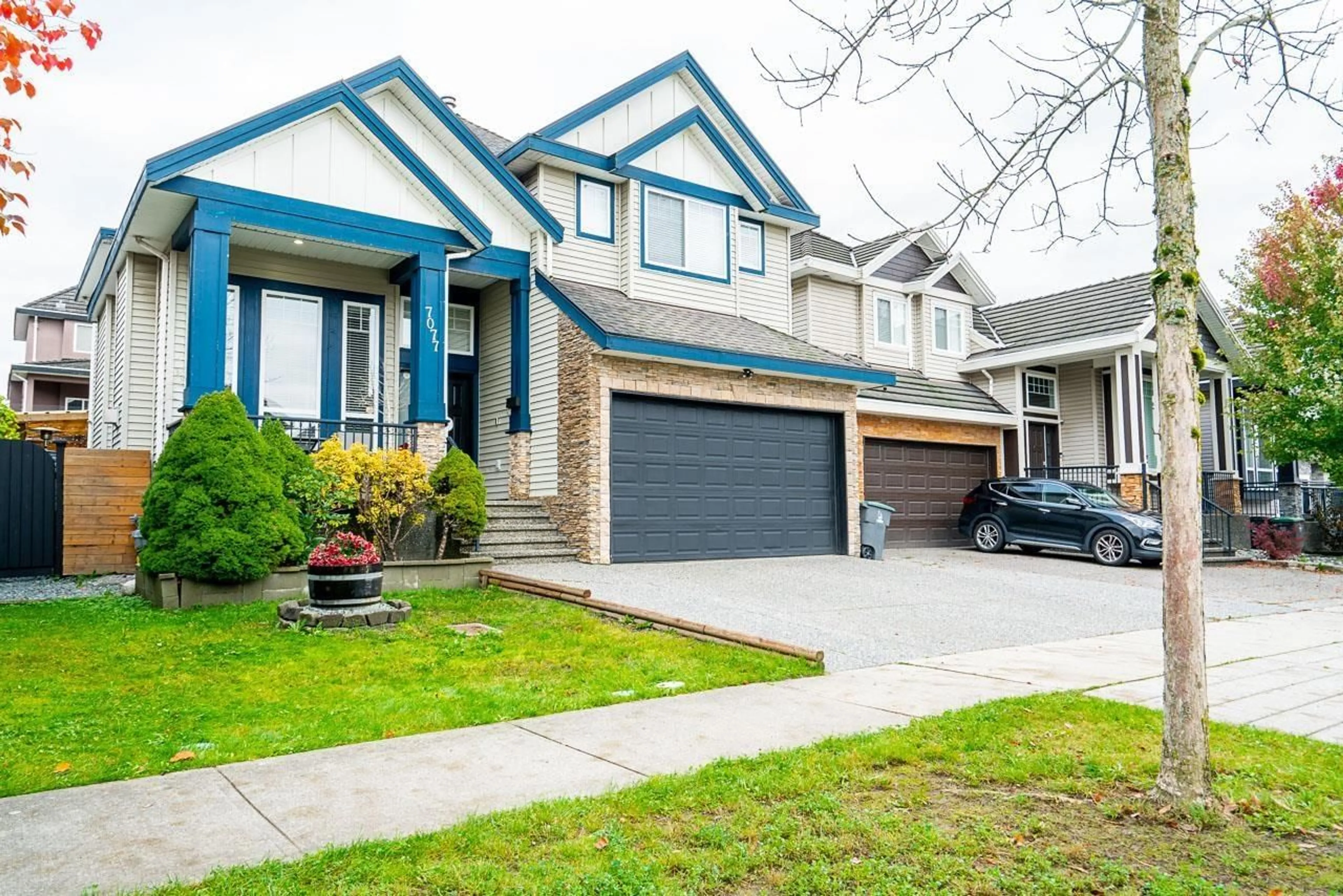 Home with vinyl exterior material, street for 7077 149A, Surrey British Columbia V3S1K2
