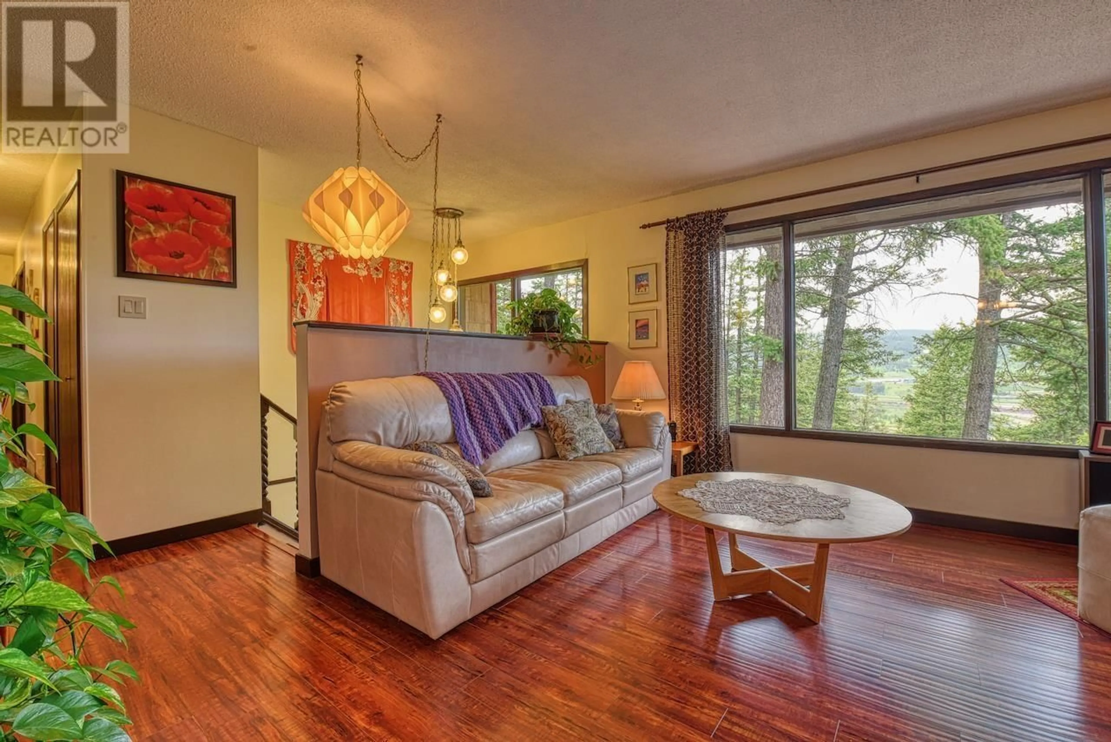 Living room with furniture, wood/laminate floor for 1195 TOWER CRESCENT, Williams Lake British Columbia V2G1A6