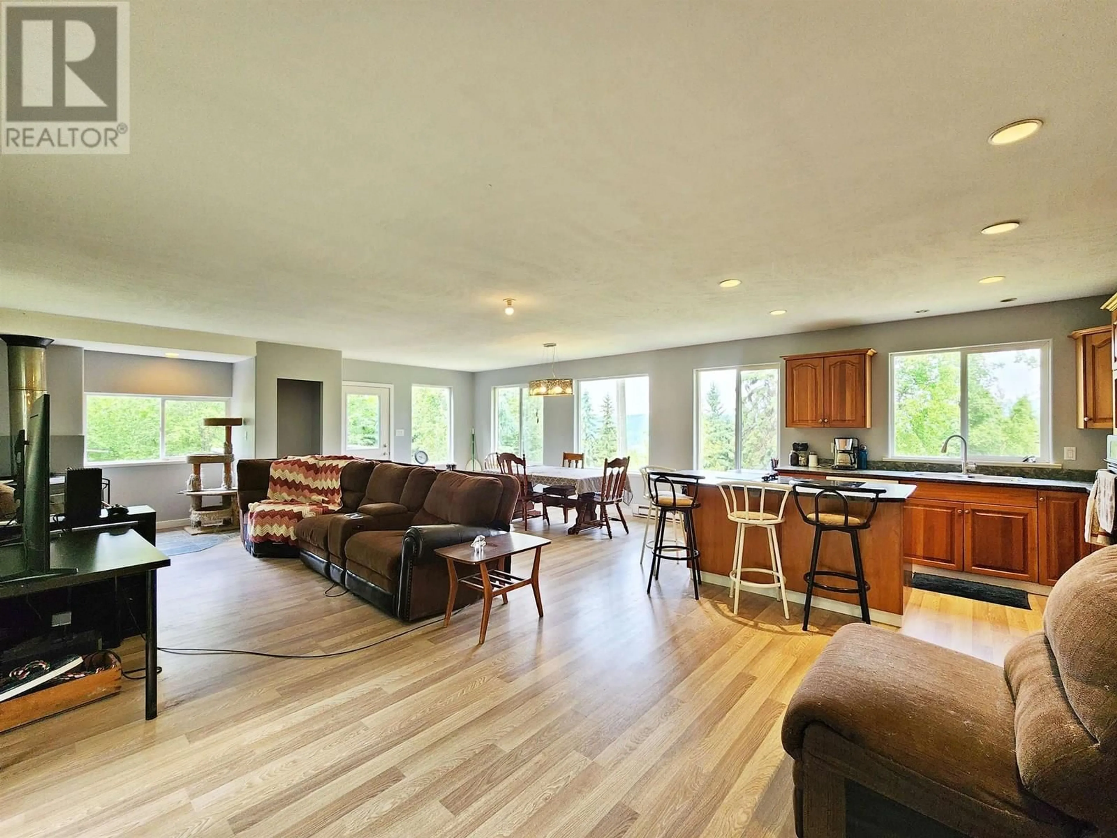 Living room with furniture, wood/laminate floor for 1392 WEST FRASER ROAD, Quesnel British Columbia V2J6J1