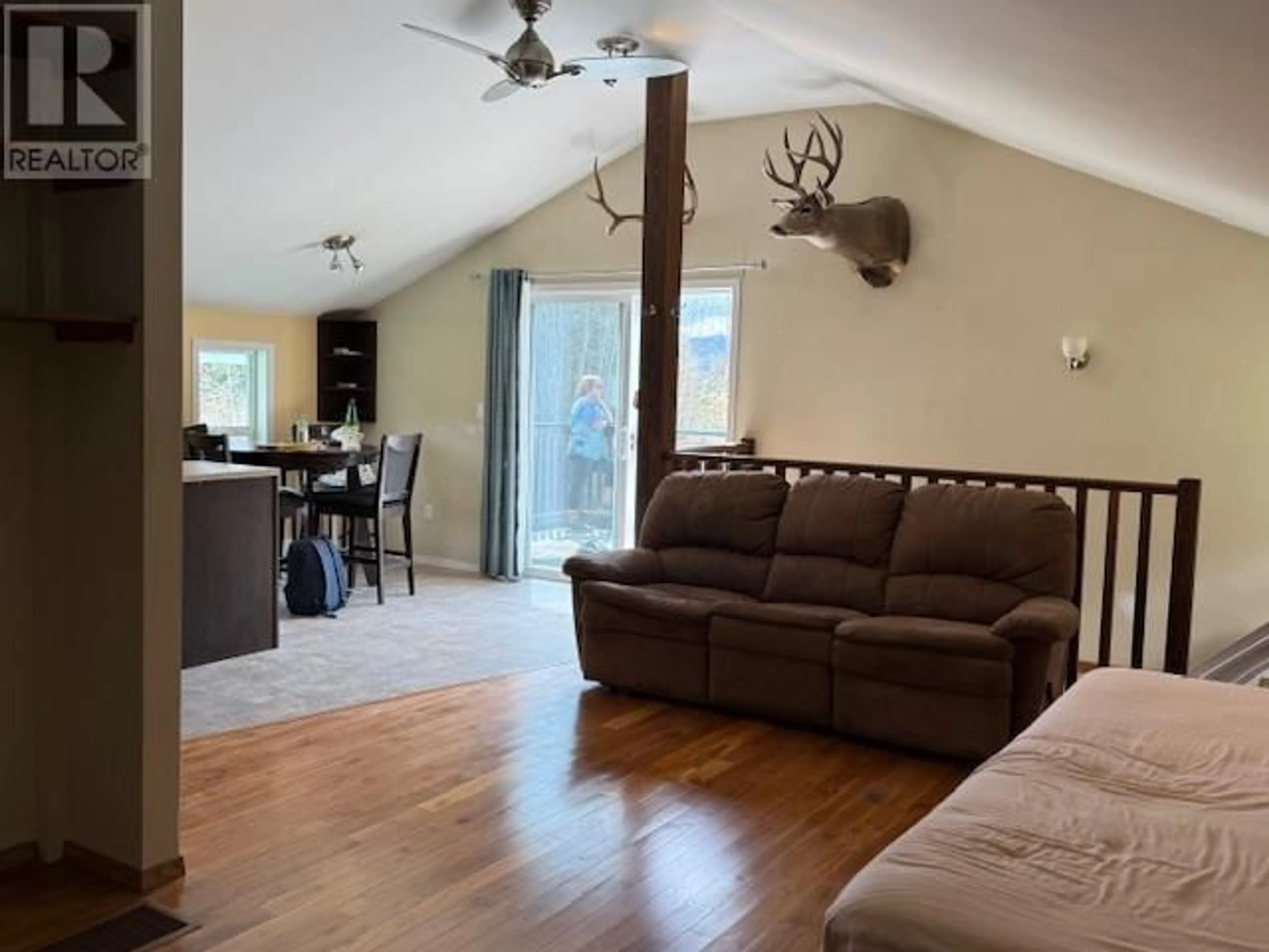 Living room with furniture, wood/laminate floor for 29575 MONTGOMERY ROAD, Topley British Columbia V0J2Y0