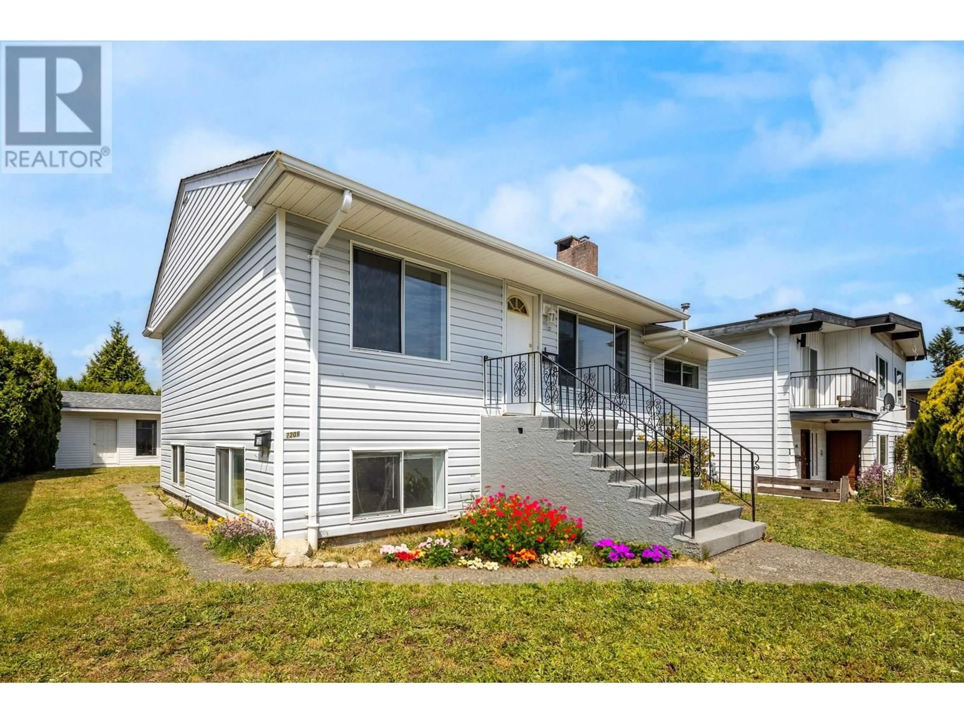 Home with vinyl exterior material, street for 7209 ELWELL STREET, Burnaby British Columbia V5E1K7