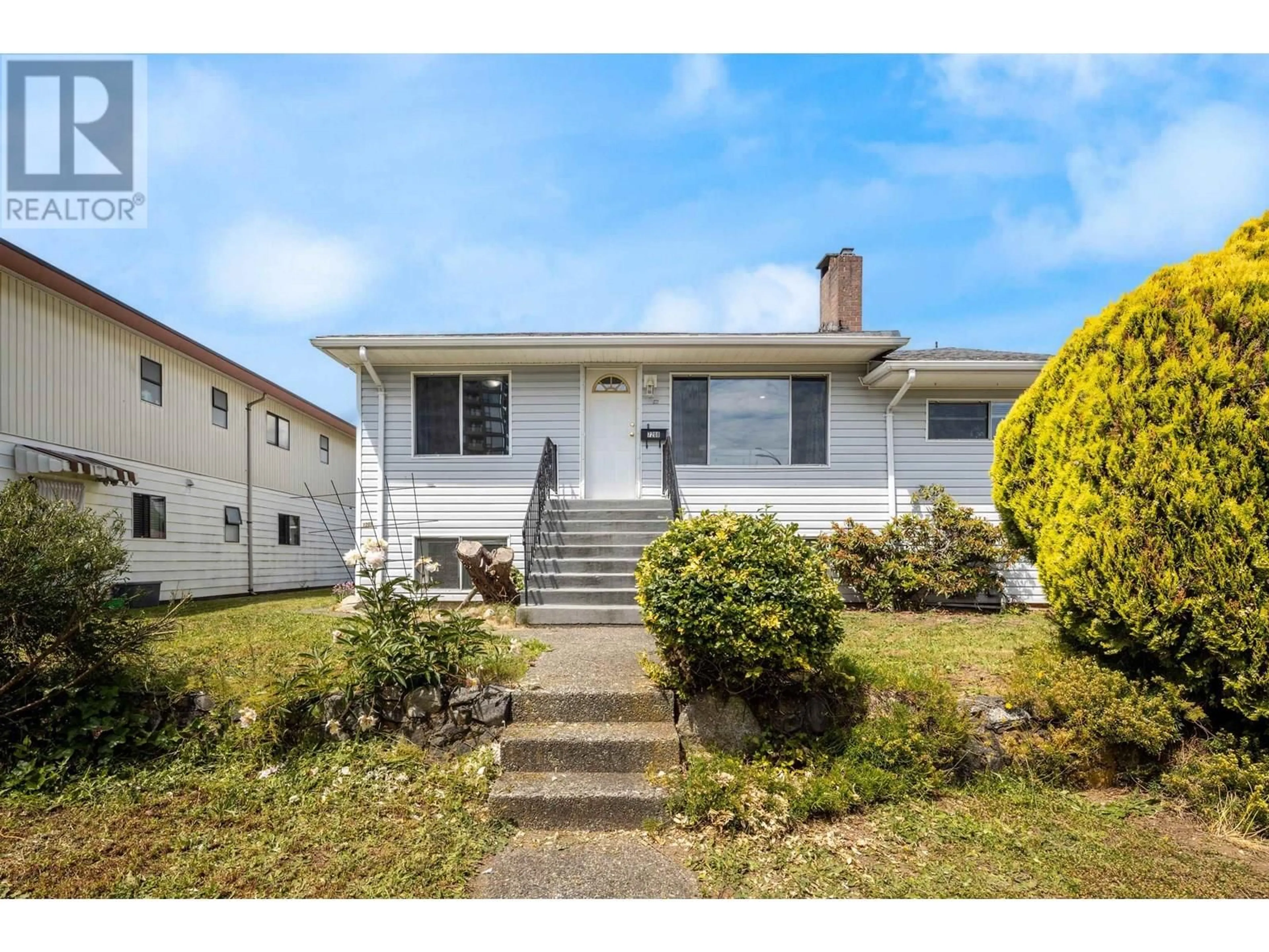 Home with vinyl exterior material, street for 7209 ELWELL STREET, Burnaby British Columbia V5E1K7