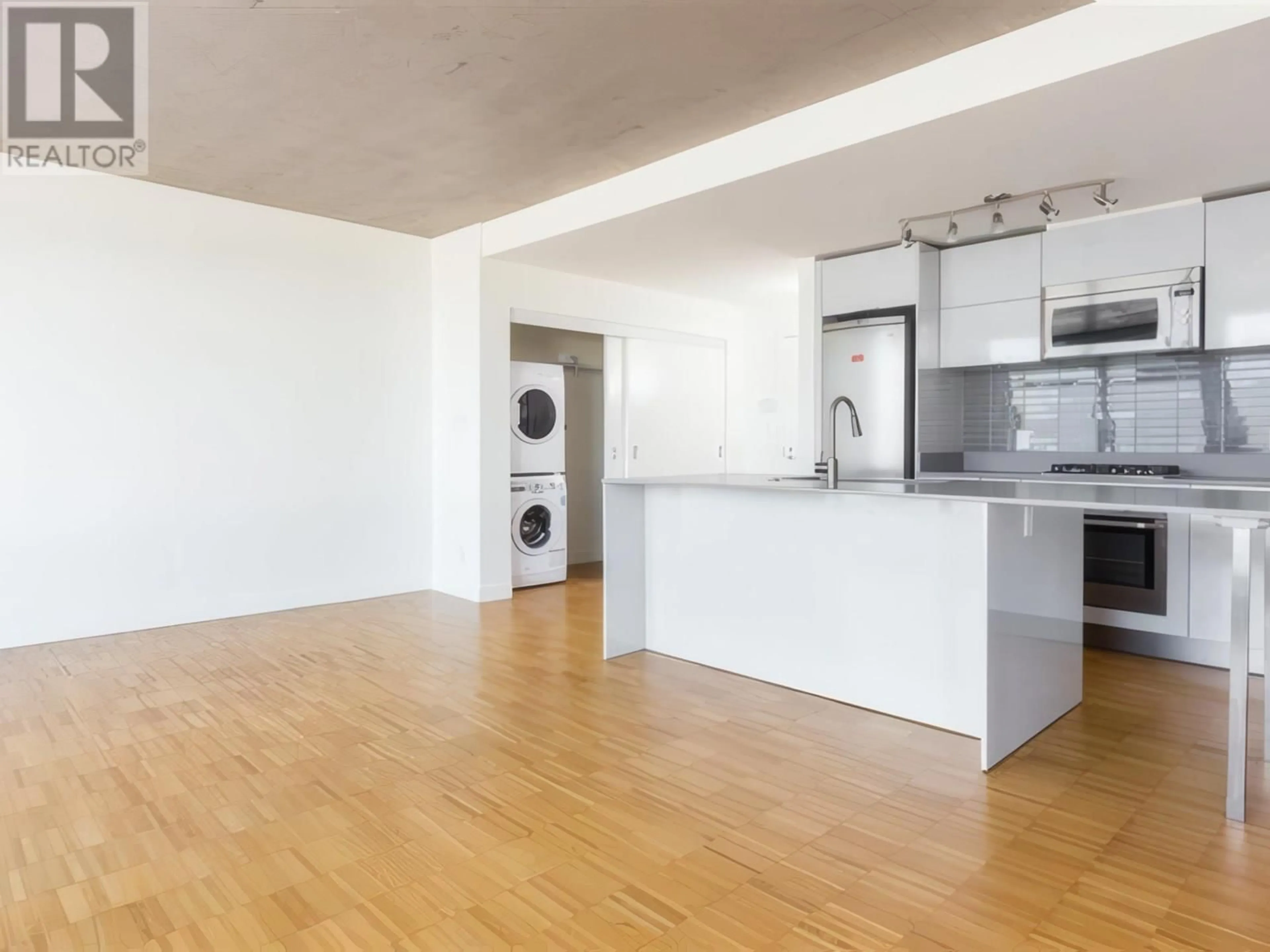 Open concept kitchen, wood/laminate floor for 2301 - 128 CORDOVA STREET, Vancouver British Columbia V6B0E6