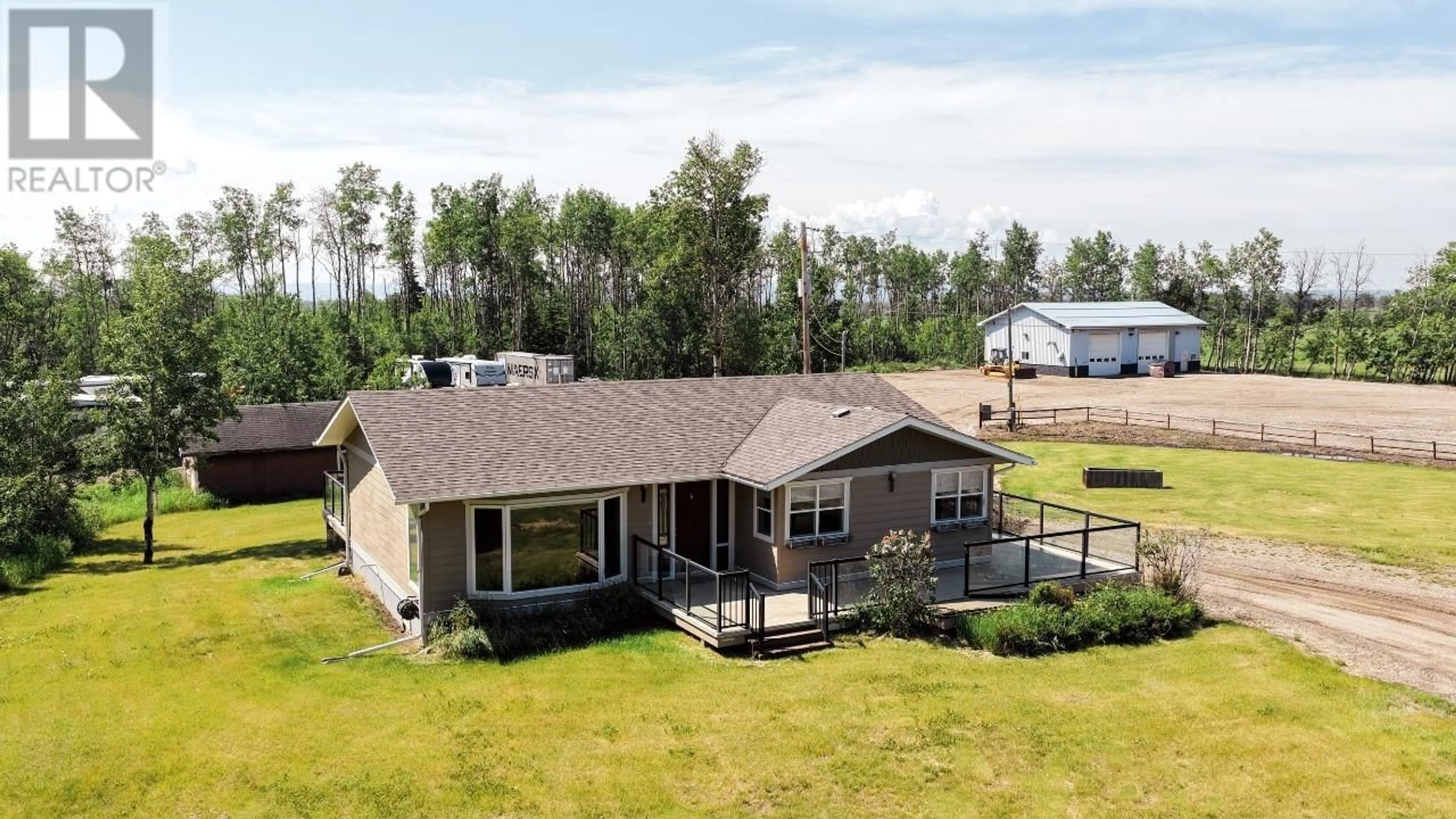 A pic from outside/outdoor area/front of a property/back of a property/a pic from drone, water/lake/river/ocean view for 6816 97 HIGHWAY, Fort St. John British Columbia V1J4H8