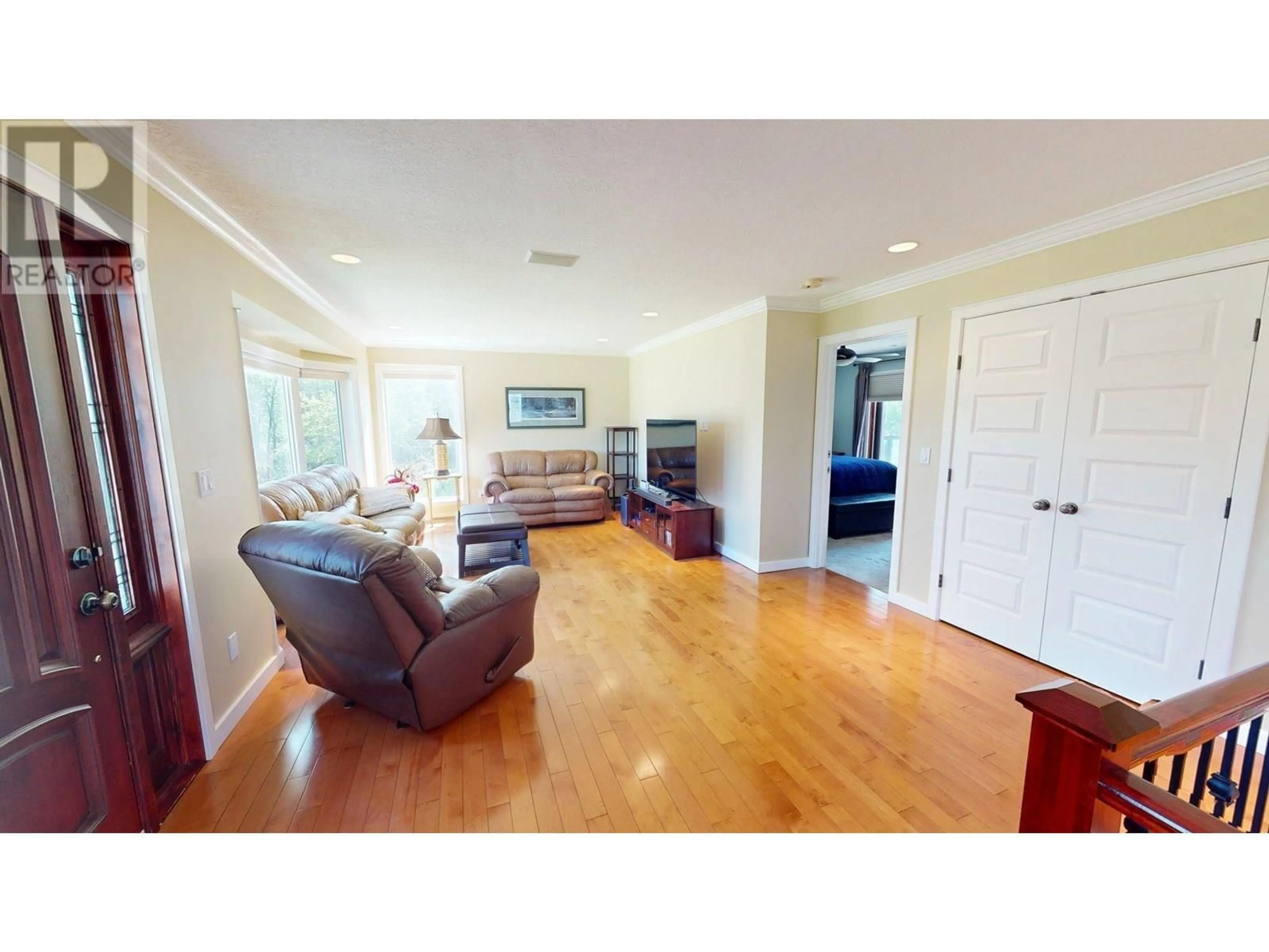Living room with furniture, wood/laminate floor for 6816 97 HIGHWAY, Fort St. John British Columbia V1J4H8