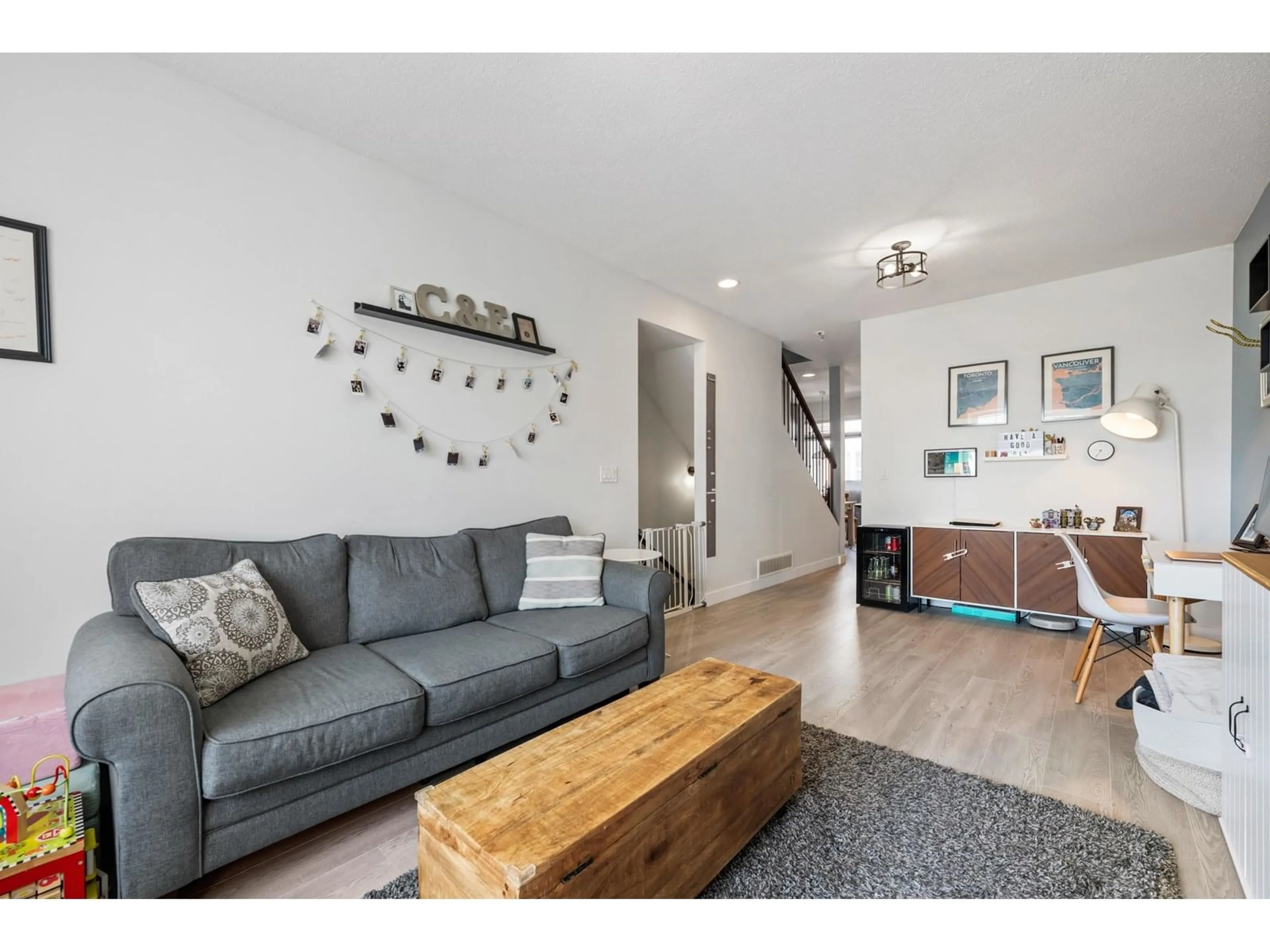Living room with furniture, wood/laminate floor for 39 - 19551 66, Surrey British Columbia V4N0Z5
