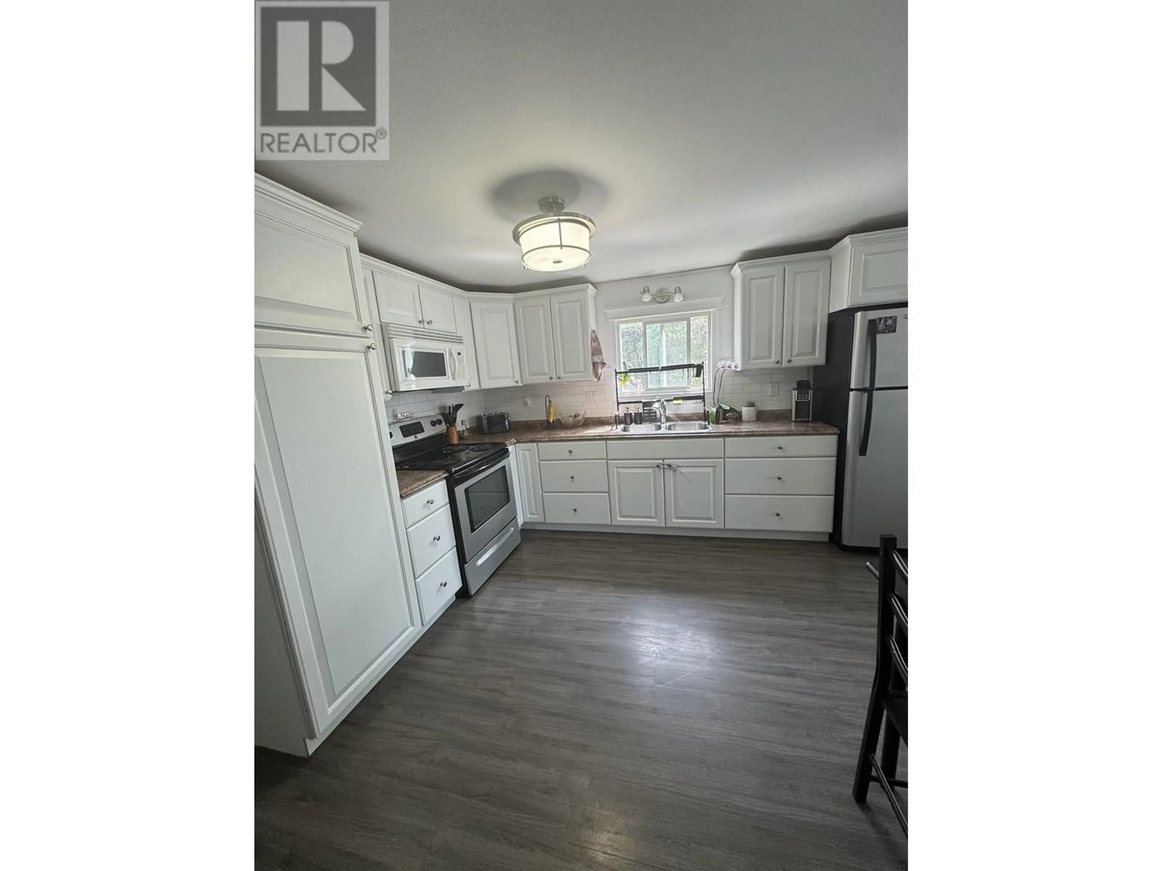 Open concept kitchen, wood/laminate floor for 101 - 8420 ALASKA ROAD, Fort St. John British Columbia V1J4J6