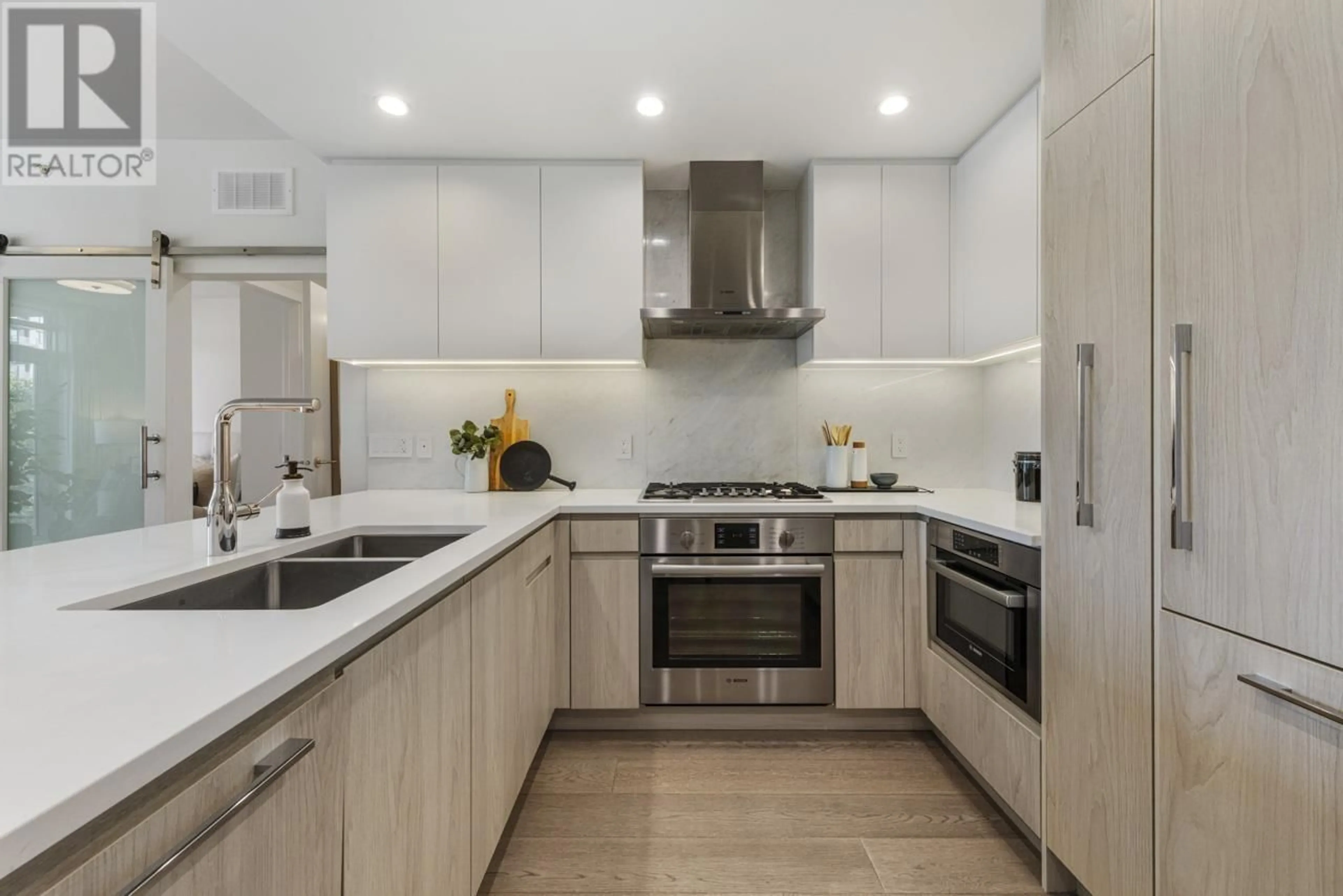 Contemporary kitchen, ceramic/tile floor for 309 - 177 3RD STREET, North Vancouver British Columbia V7M0G5