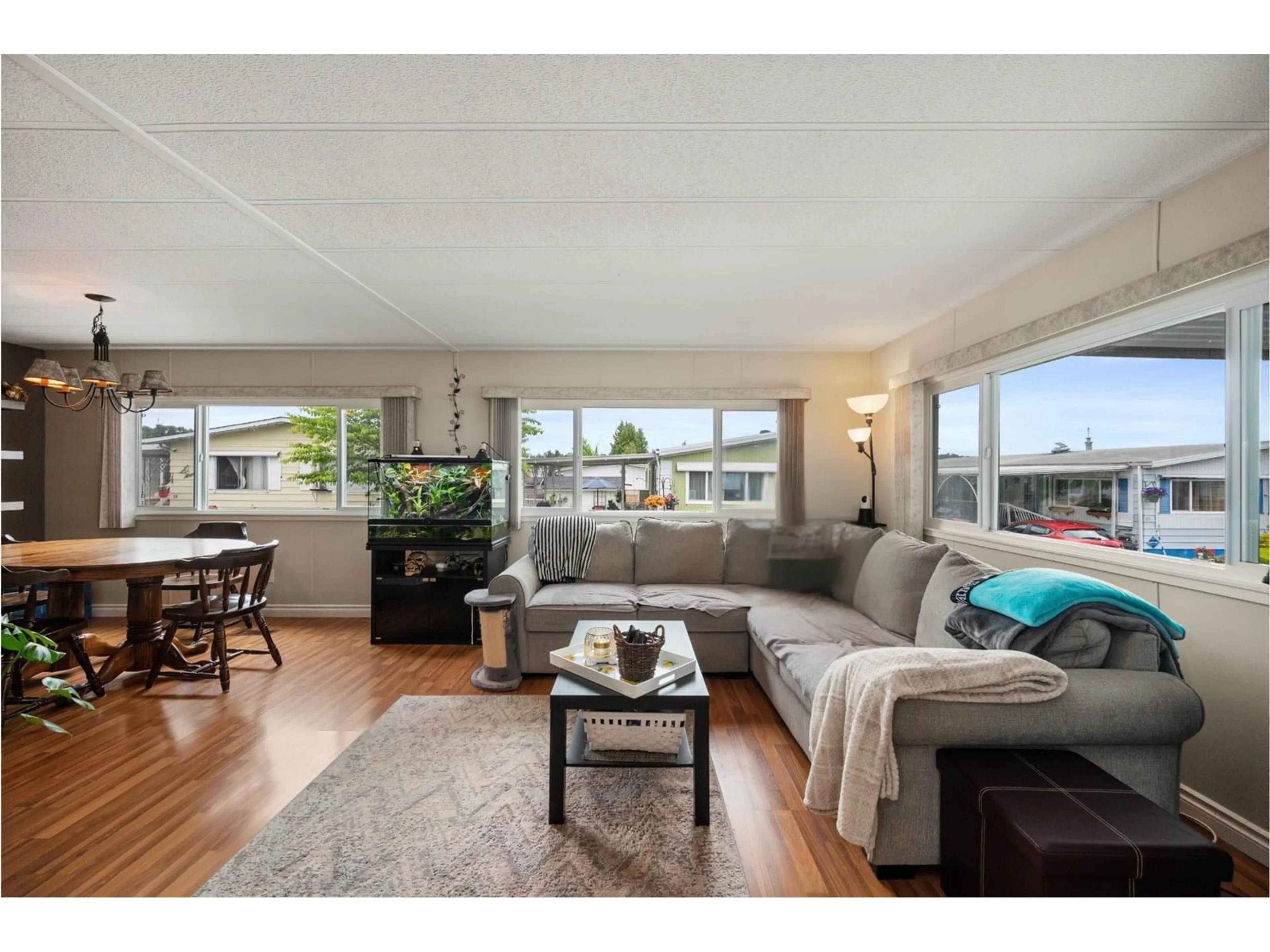 Living room with furniture, wood/laminate floor for 22 - 8254 134, Surrey British Columbia V3W6M2