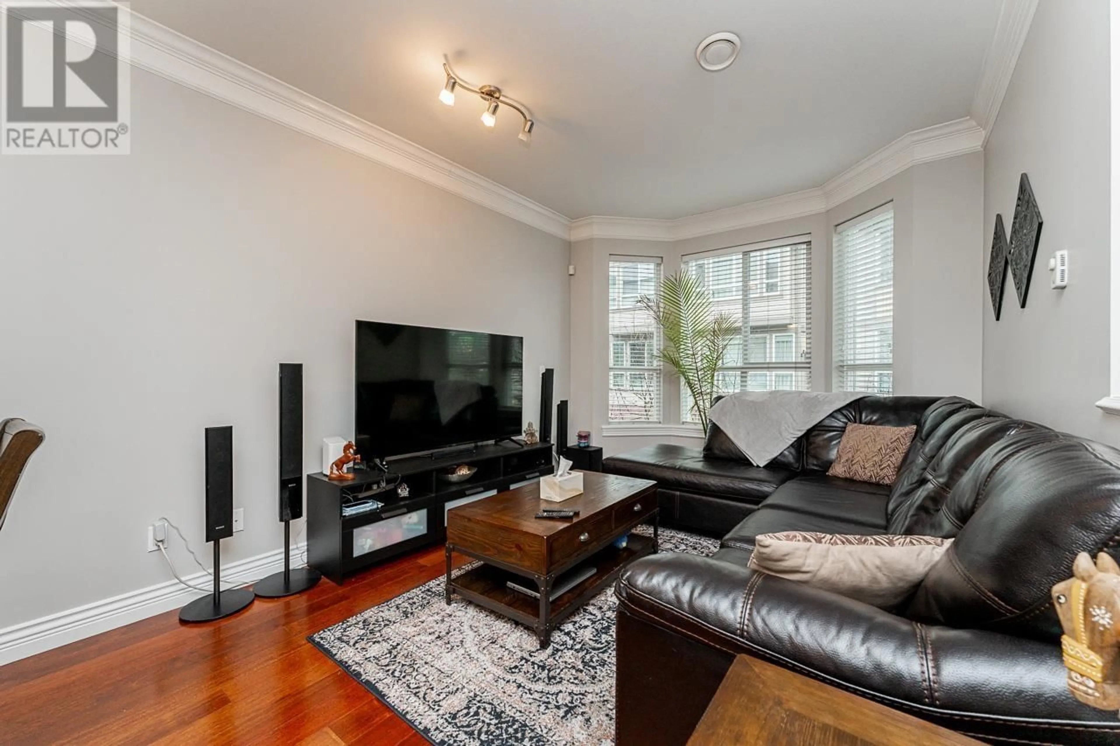 Living room with furniture, wood/laminate floor for 11 - 9051 BLUNDELL ROAD, Richmond British Columbia V6Y1K4