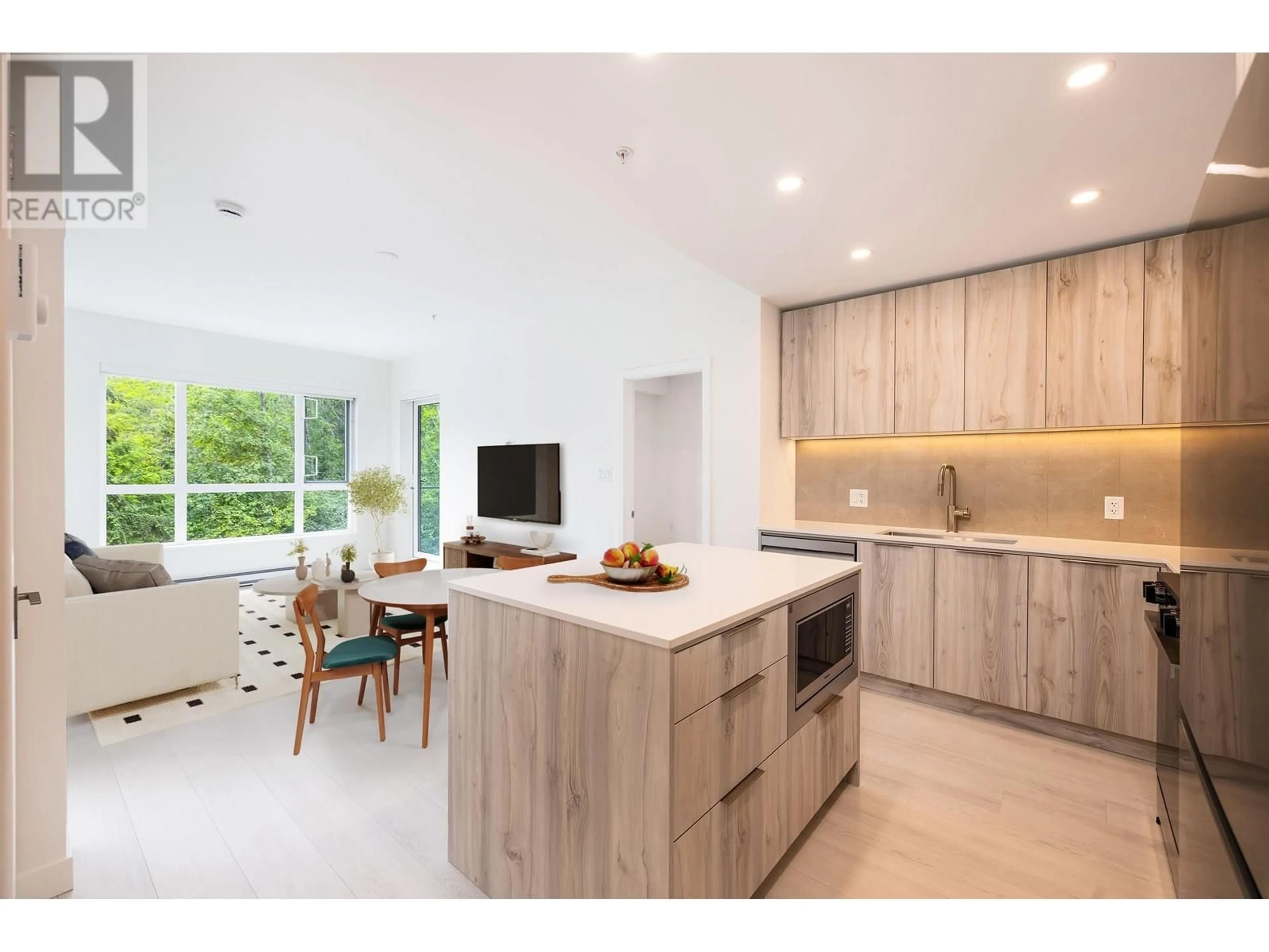 Open concept kitchen, wood/laminate floor for 406 - 3594 MALSUM DRIVE, North Vancouver British Columbia V7G0B4