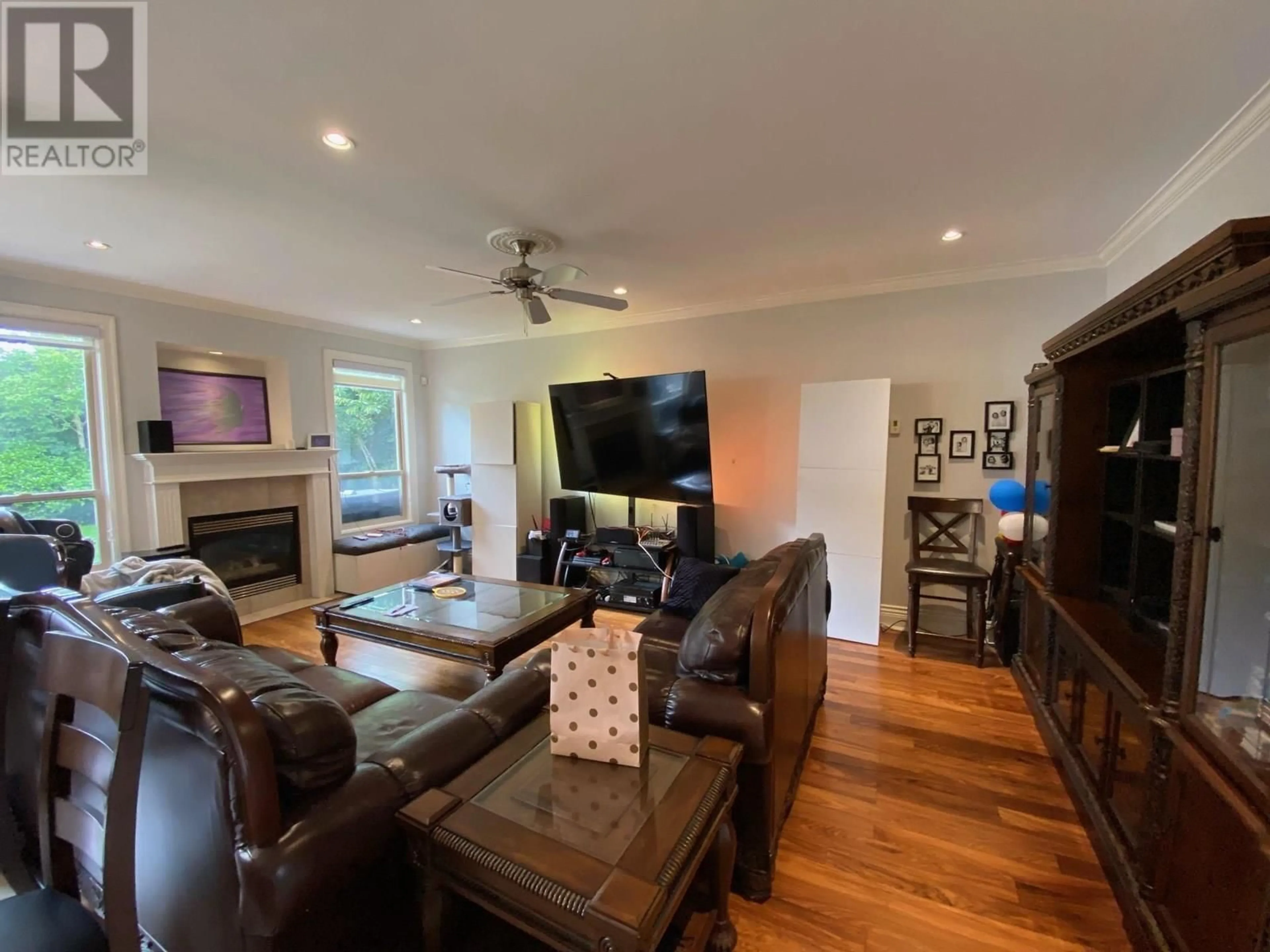 Living room with furniture, wood/laminate floor for 4680 GRANVILLE AVENUE, Richmond British Columbia V7C1E4