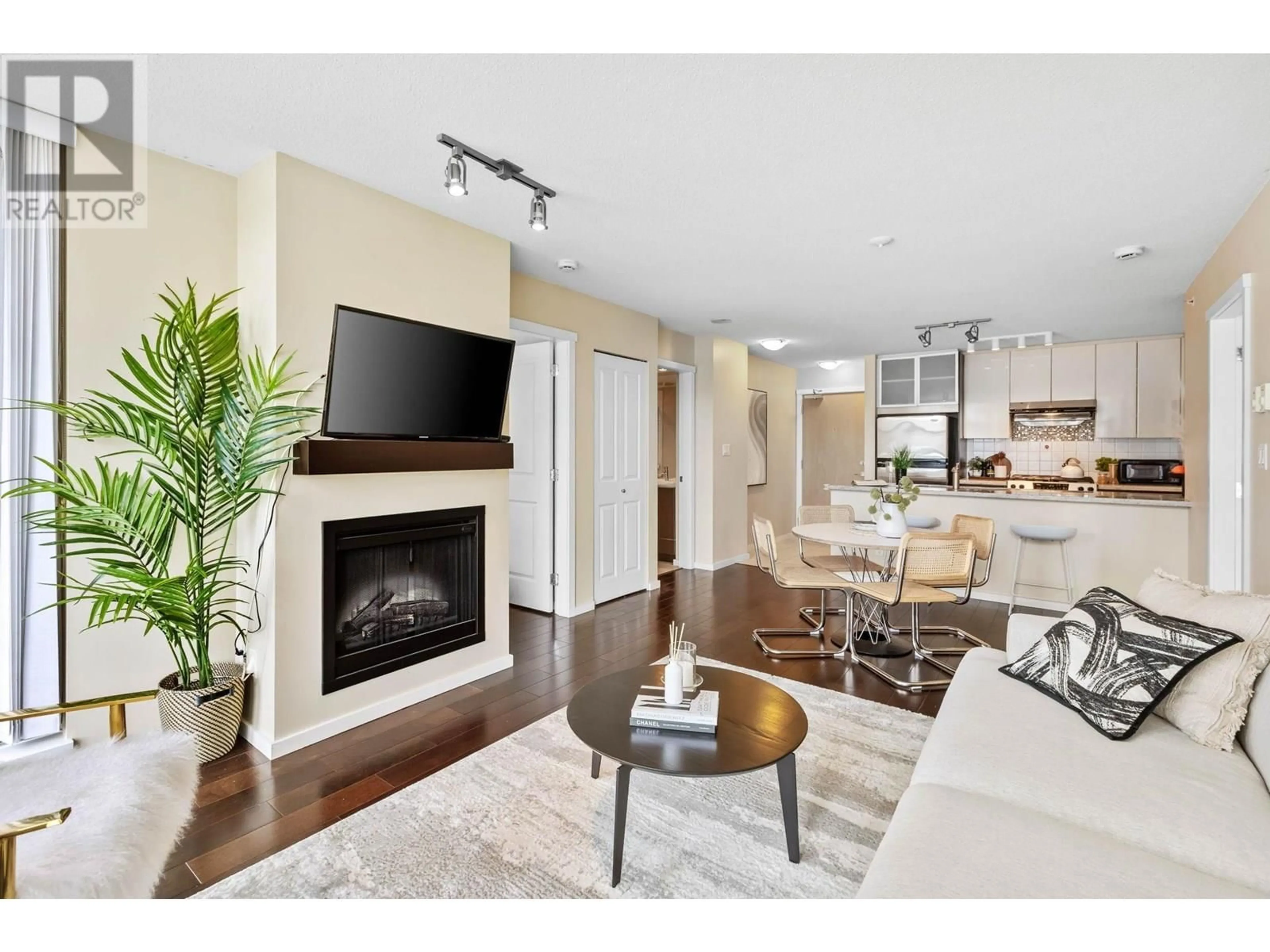 Living room with furniture, wood/laminate floor for 1102 - 2289 YUKON CRESCENT, Burnaby British Columbia V5C0B2