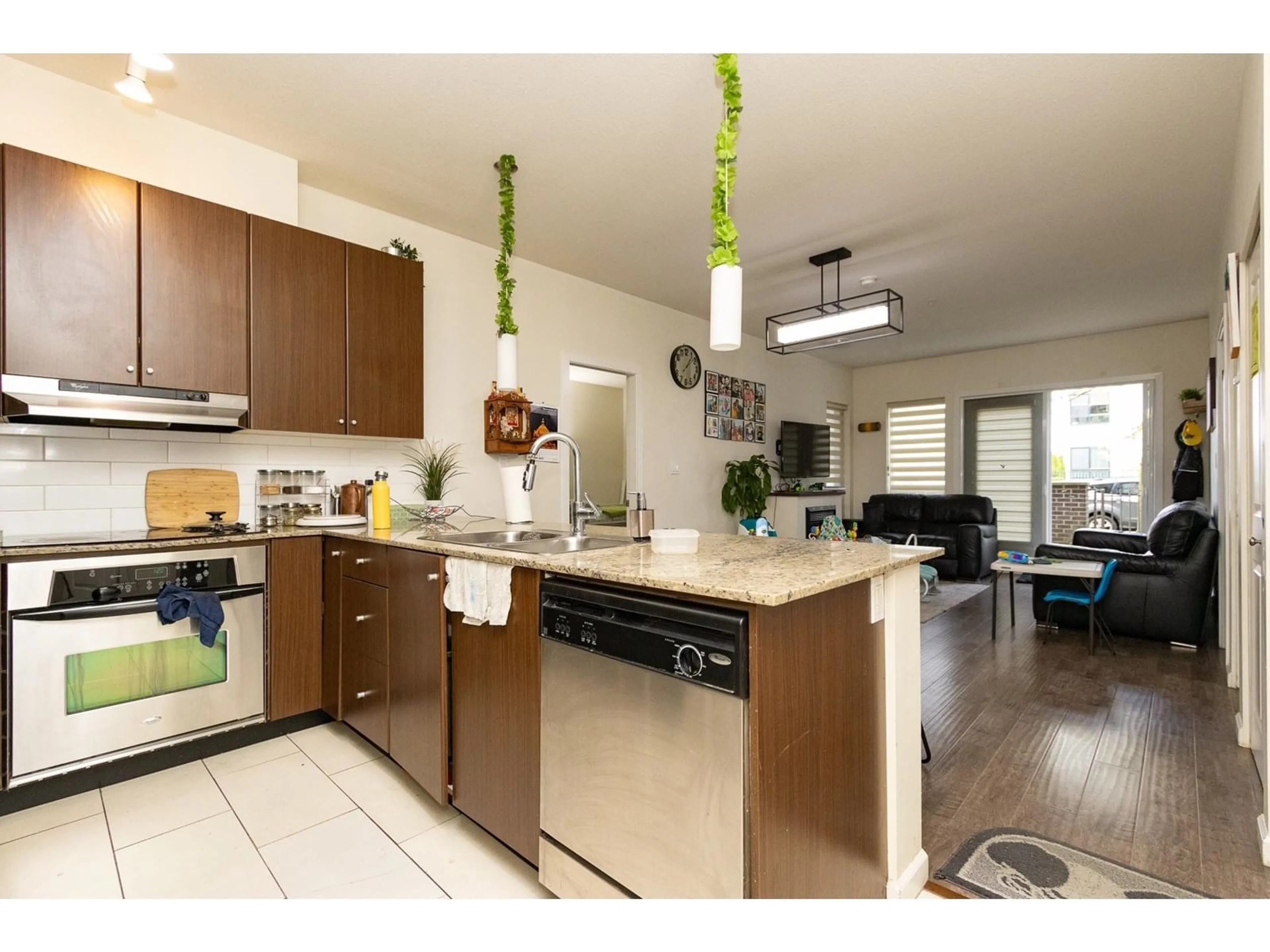 Open concept kitchen, wood/laminate floor for 103 - 15322 101, Surrey British Columbia V3R4G9