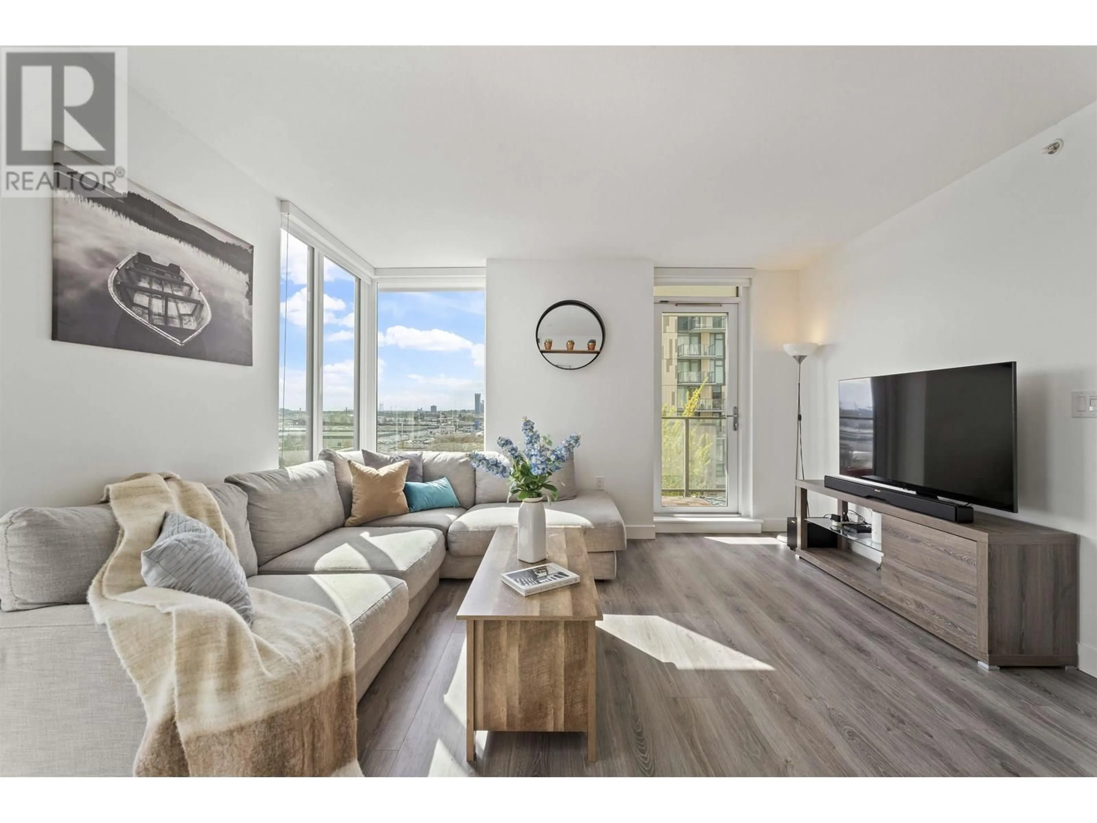 Living room with furniture, wood/laminate floor for 807 - 8181 CHESTER STREET, Vancouver British Columbia V5X0J9
