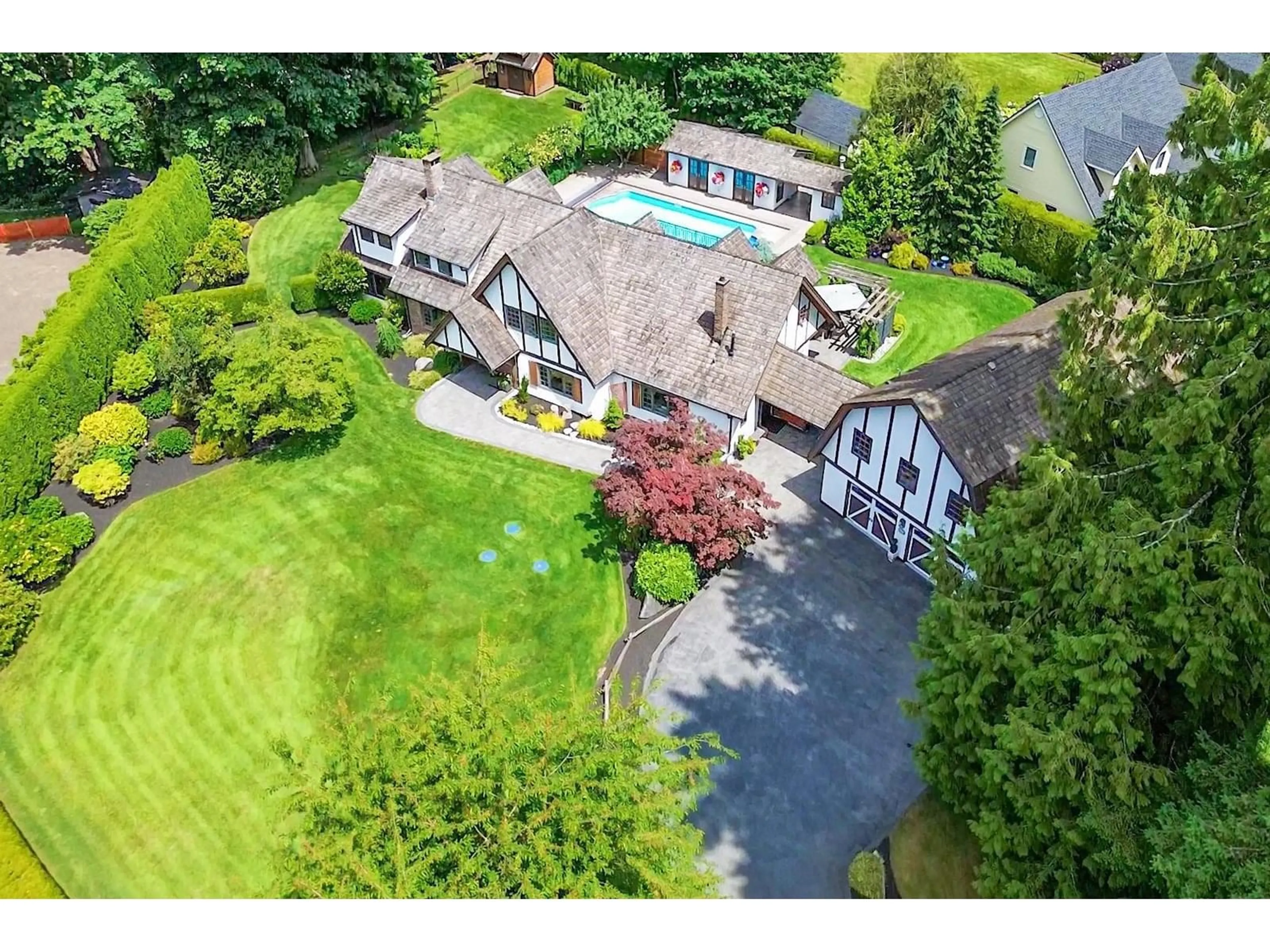 A pic from outside/outdoor area/front of a property/back of a property/a pic from drone, street for 24311 63, Langley British Columbia V2Y2G4
