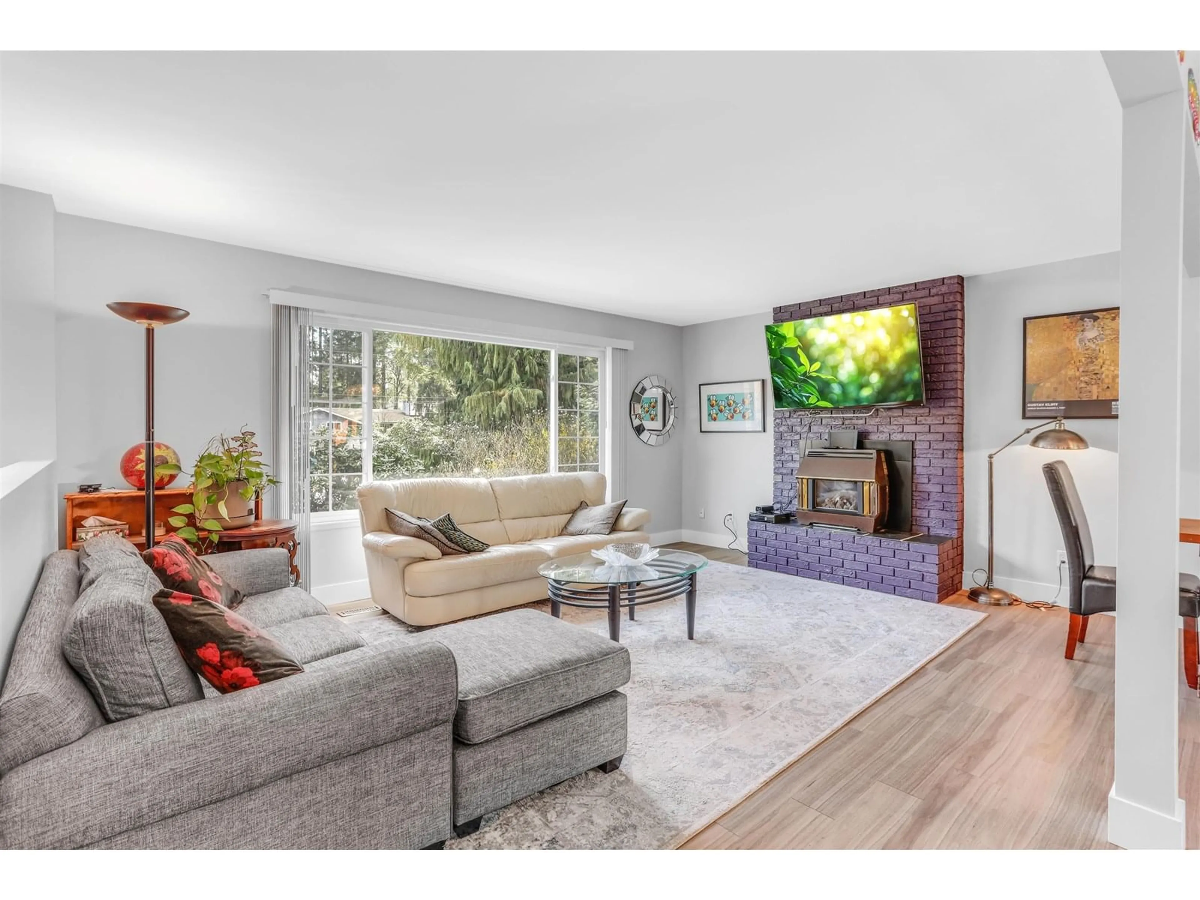 Living room with furniture, wood/laminate floor for 3943 202A, Langley British Columbia V3A1T3