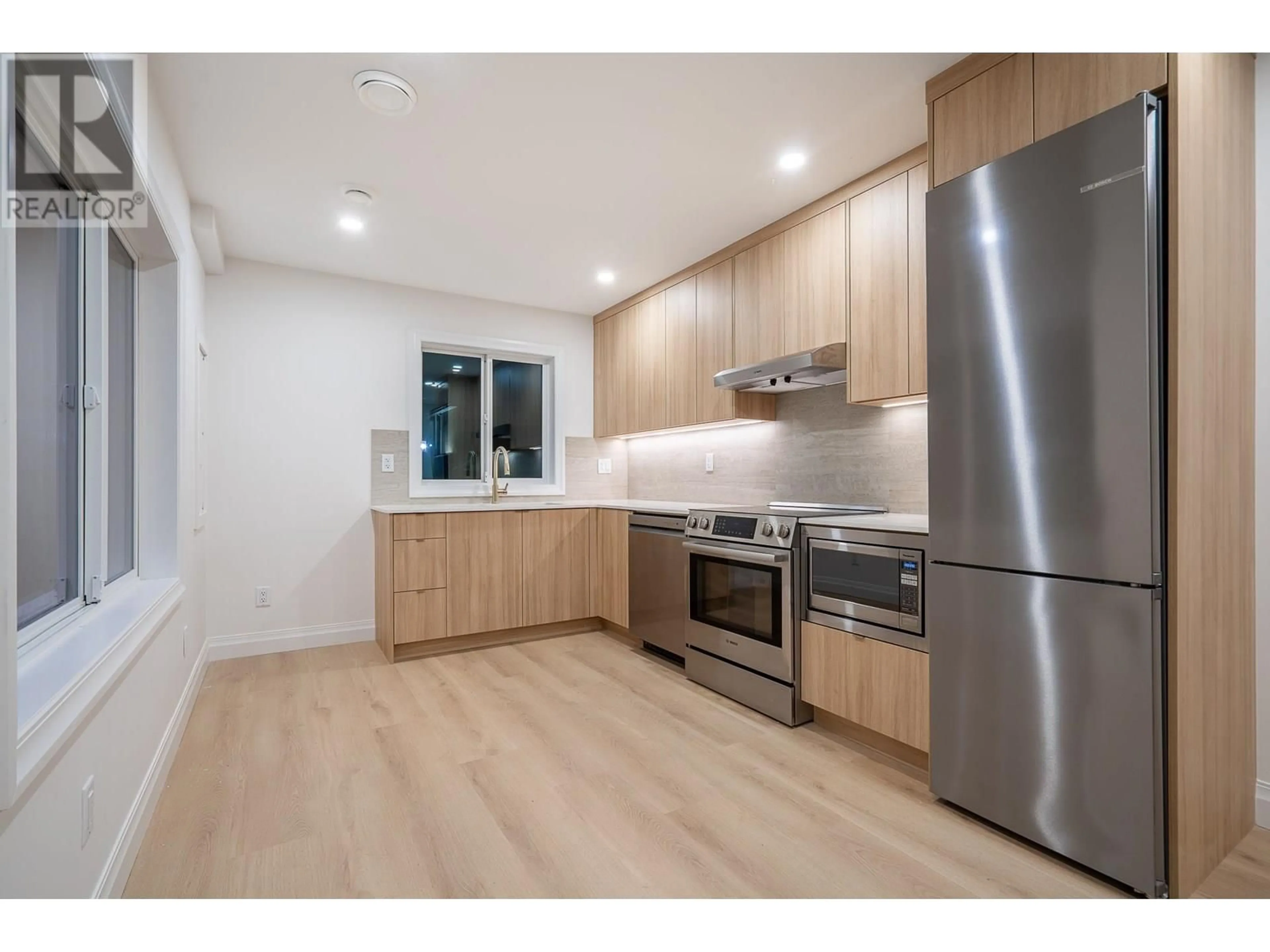 Standard kitchen, wood/laminate floor for L1 - 4064 PENDER STREET, Burnaby British Columbia V5C2L8
