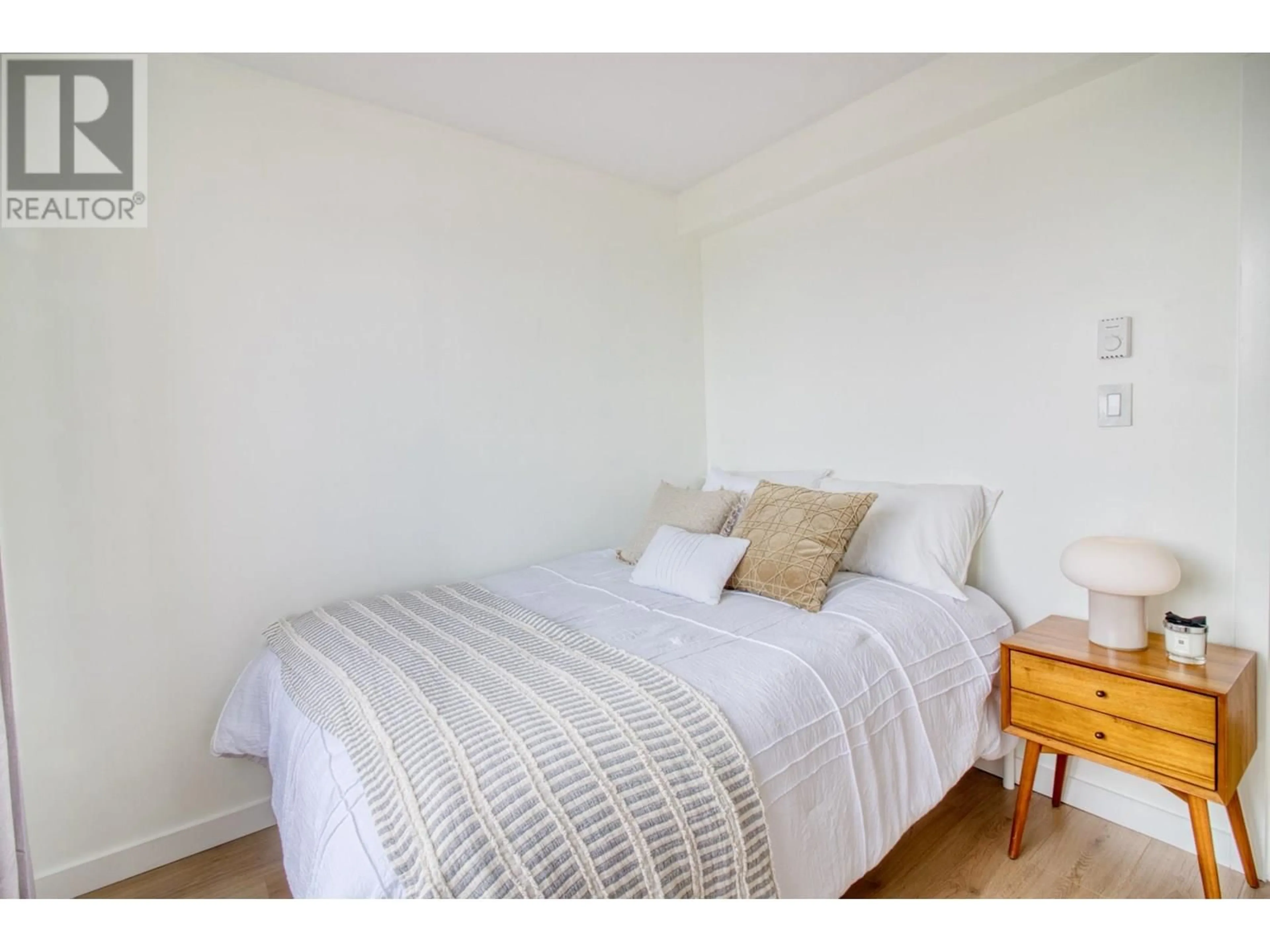 Bedroom with bed, wood/laminate floor for 803 - 2483 SPRUCE STREET, Vancouver British Columbia V6H4J2