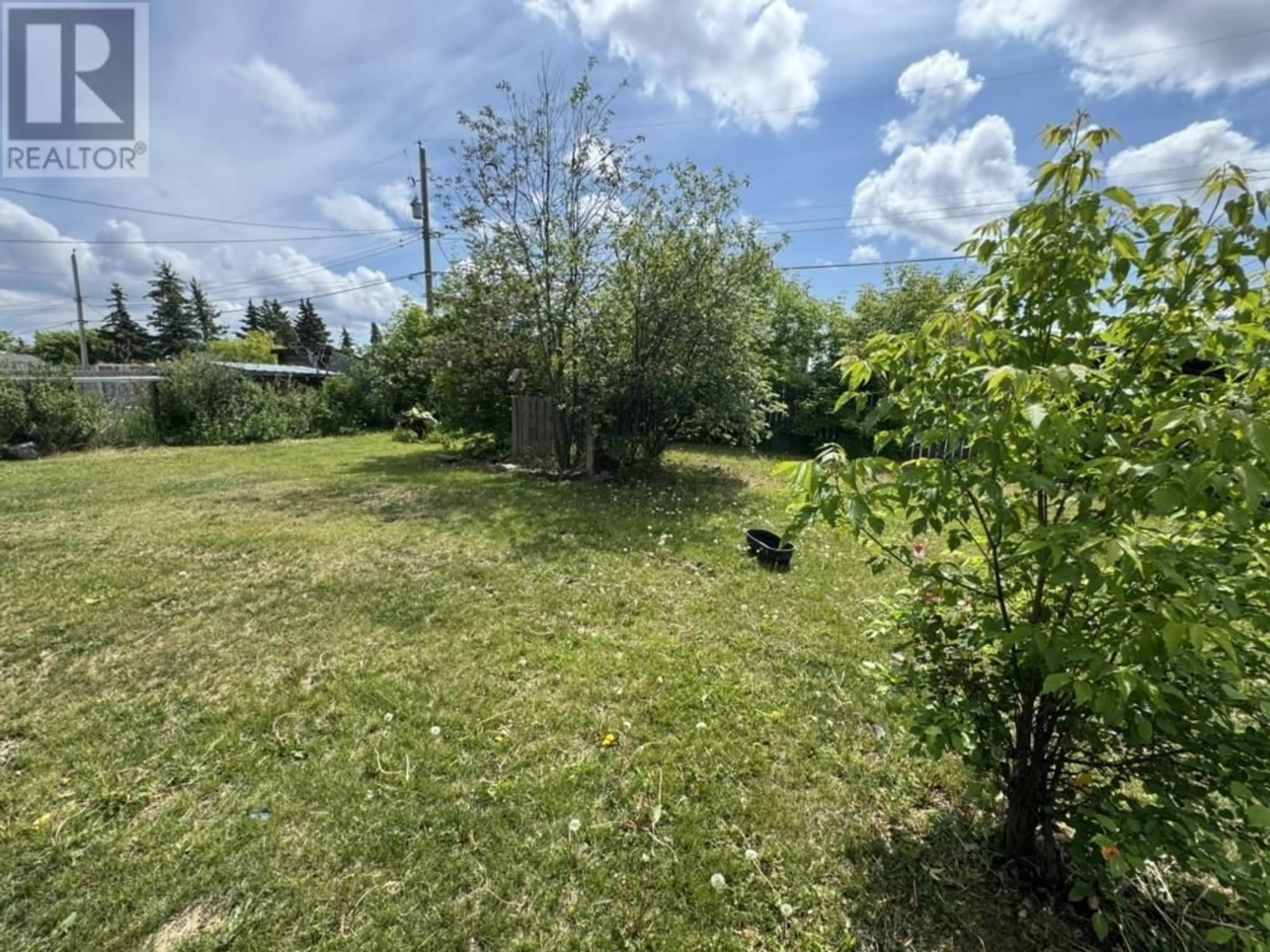 A pic from outside/outdoor area/front of a property/back of a property/a pic from drone, forest/trees view for 9615 104 AVENUE, Fort St. John British Columbia V1J2K1