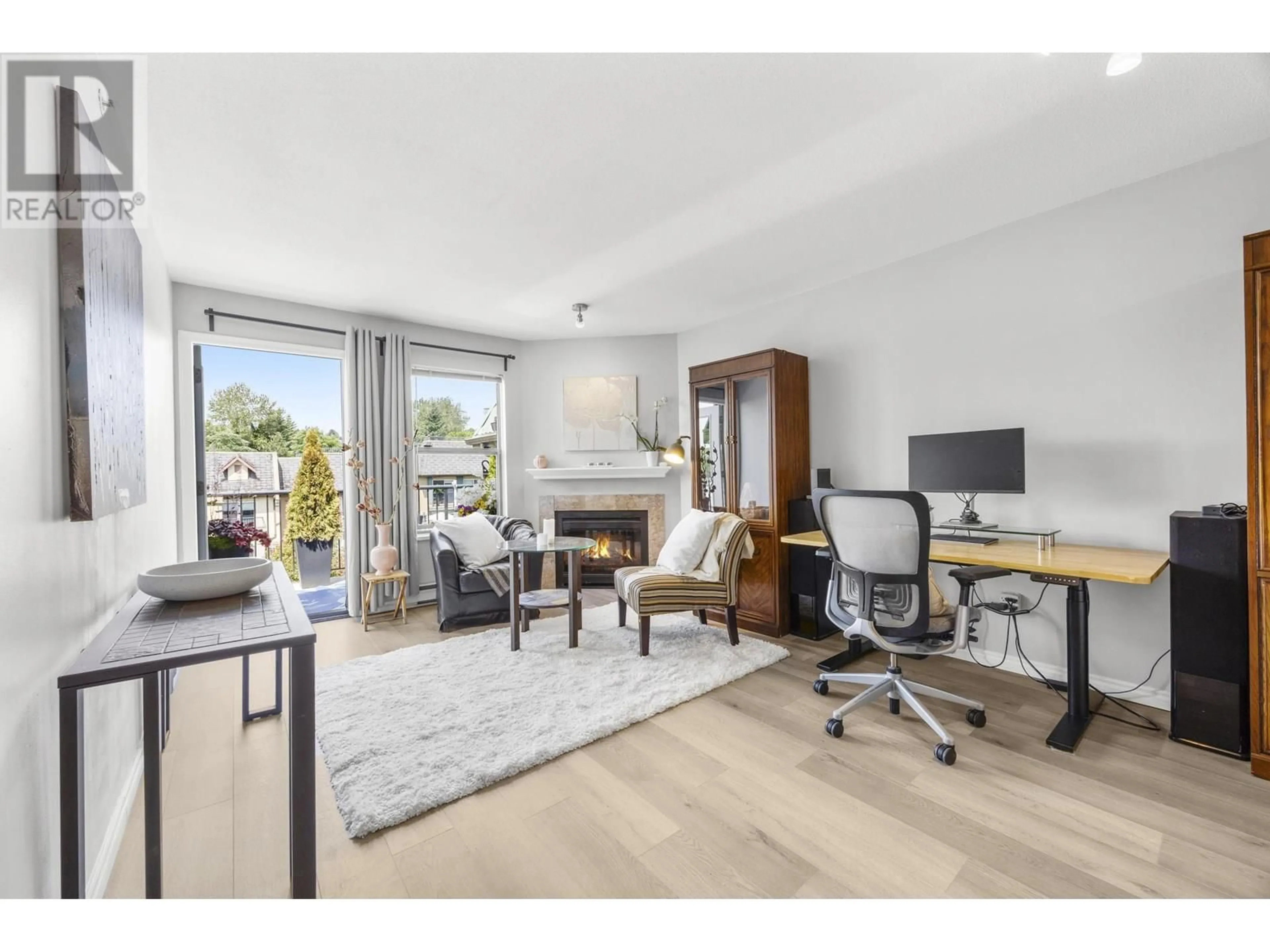 Living room with furniture, wood/laminate floor for 409 - 1591 BOOTH AVENUE, Coquitlam British Columbia V3K1B7